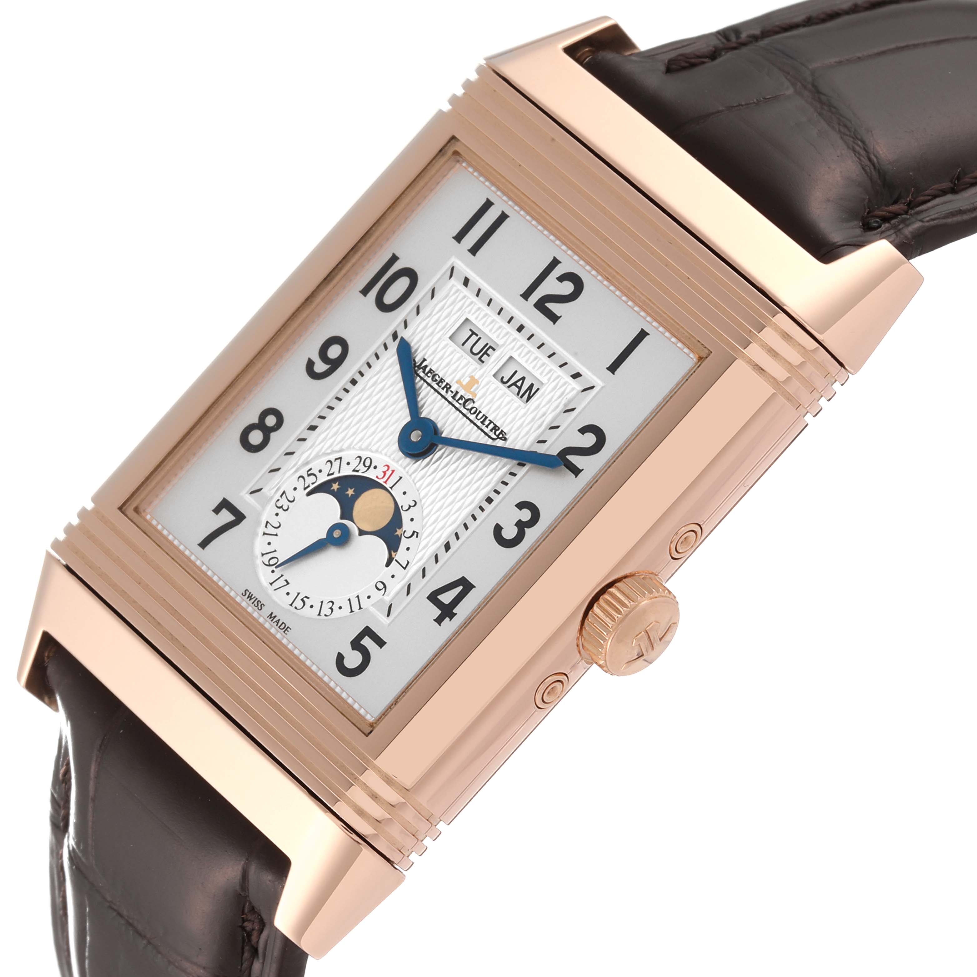 The Jaeger-LeCoultre Reverso watch is shown at an angle emphasizing the dial, crown, and part of the strap.