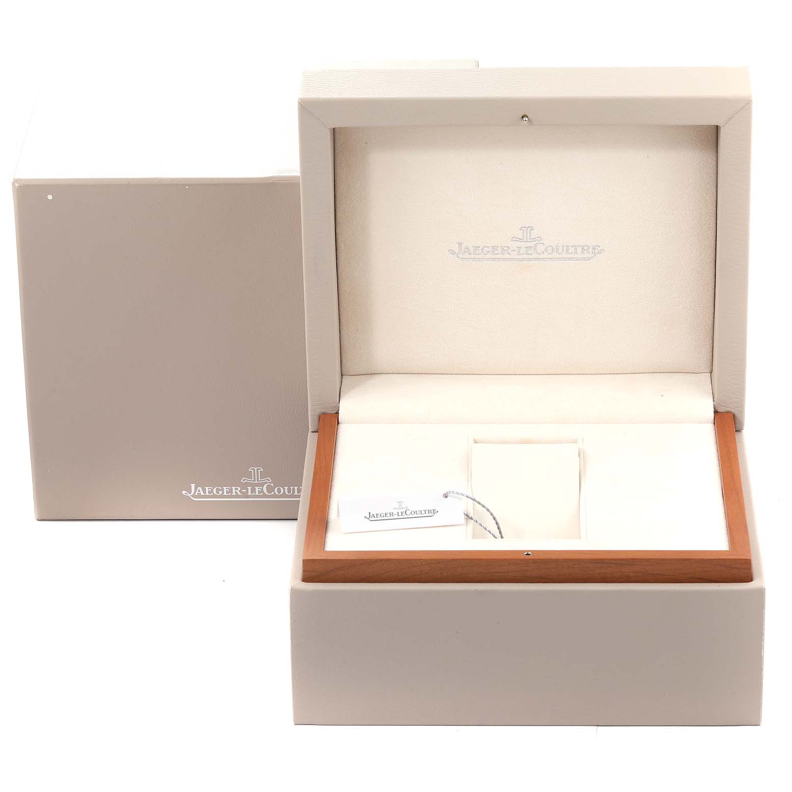 The image shows an open Jaeger-LeCoultre Reverso watch box and an outer box from a frontal angle.