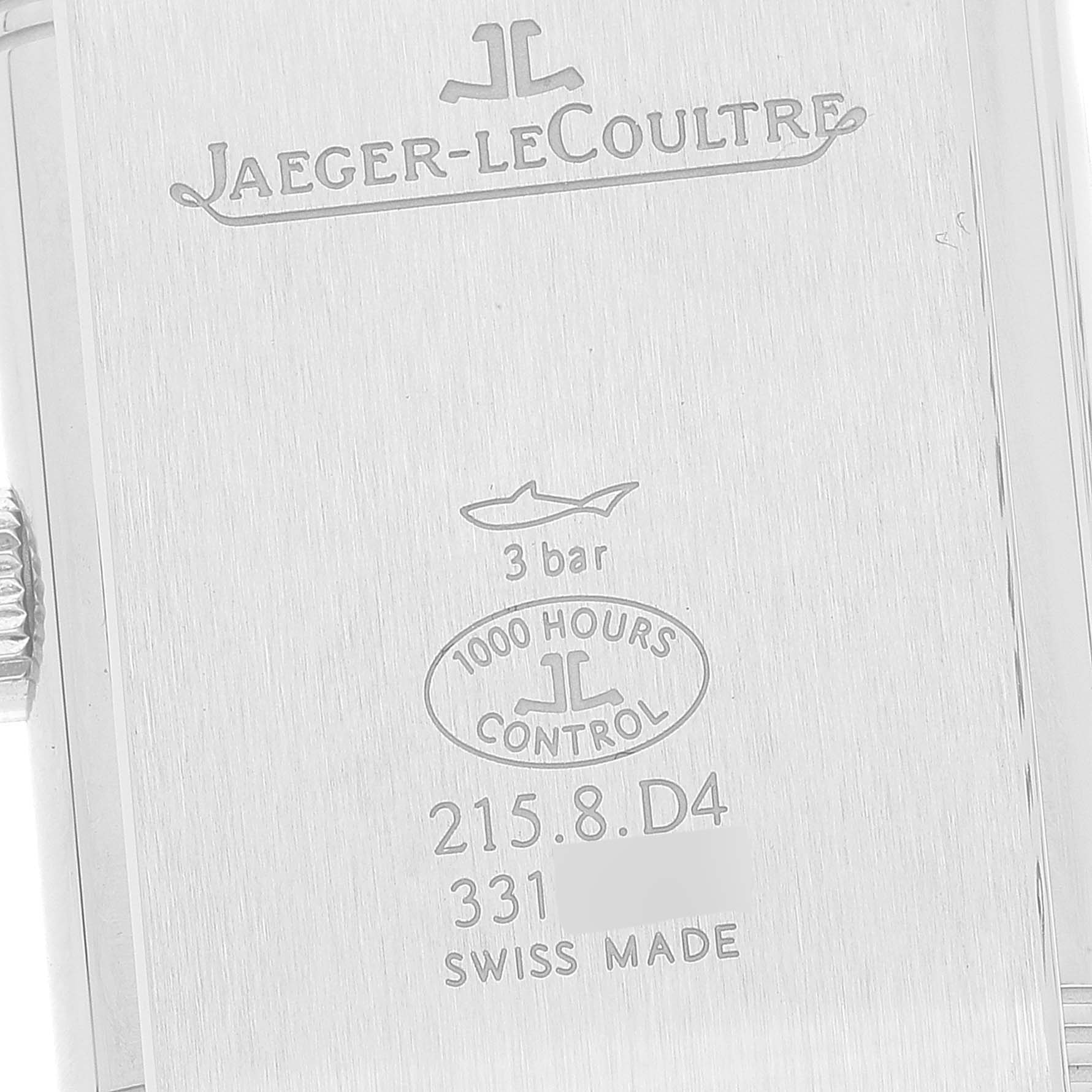 This image shows the back of a Jaeger-LeCoultre Reverso watch, highlighting the engravings and branding.