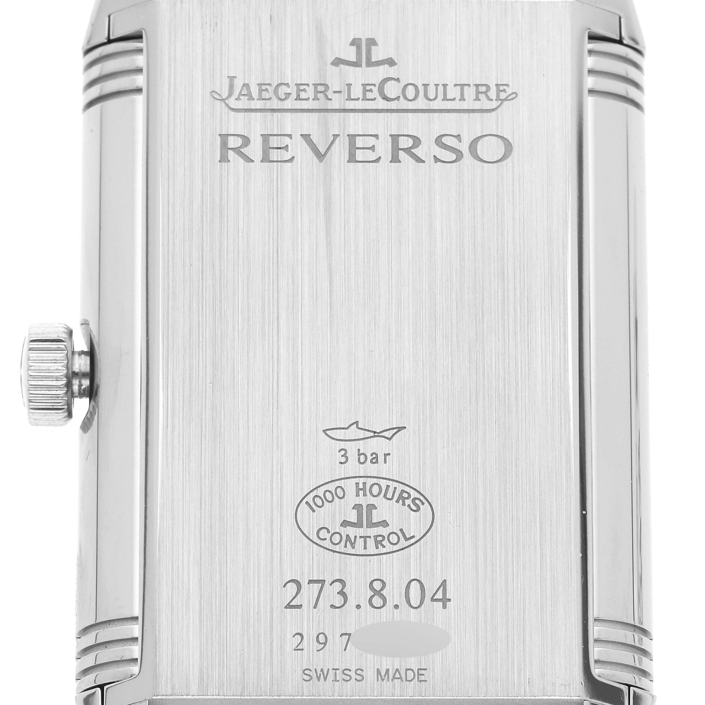 The image shows the back case of a Jaeger-LeCoultre Reverso watch, with the crown to the side.