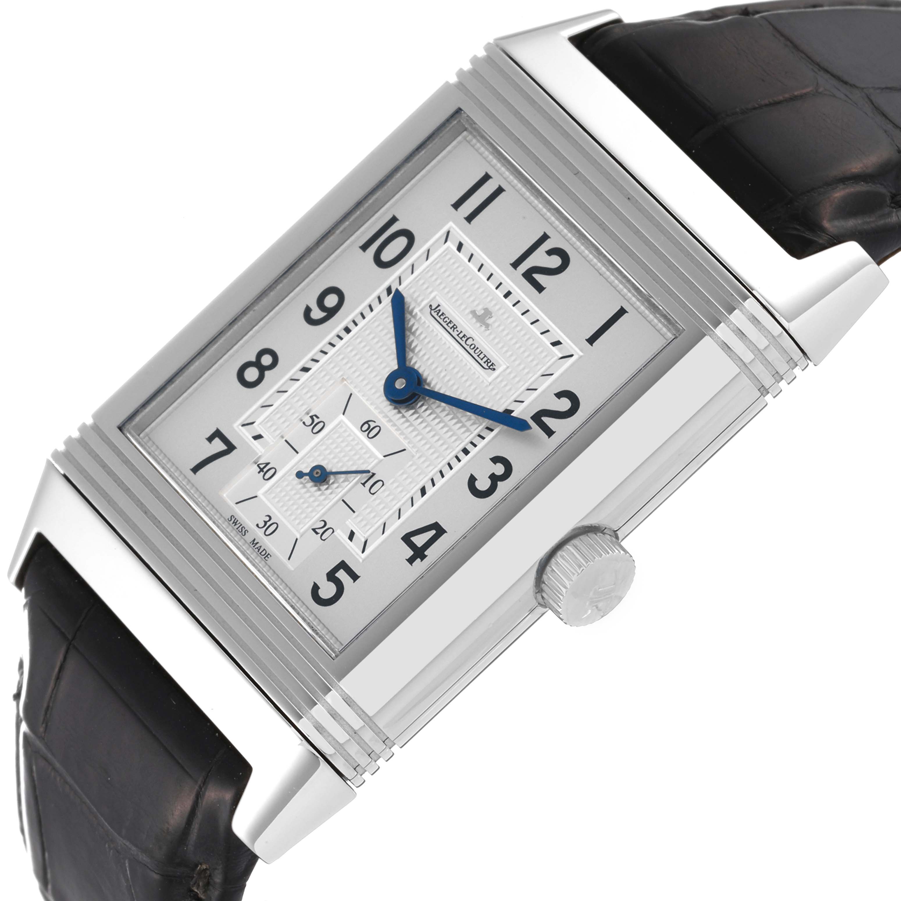 This image shows a close-up, angled view of the Jaeger LeCoultre Reverso Q3738420 Men's Stainless Steel Silver Dial Q3738420 Men's Stainless Steel Silver Dial watch face and crown, with part of the strap visible.