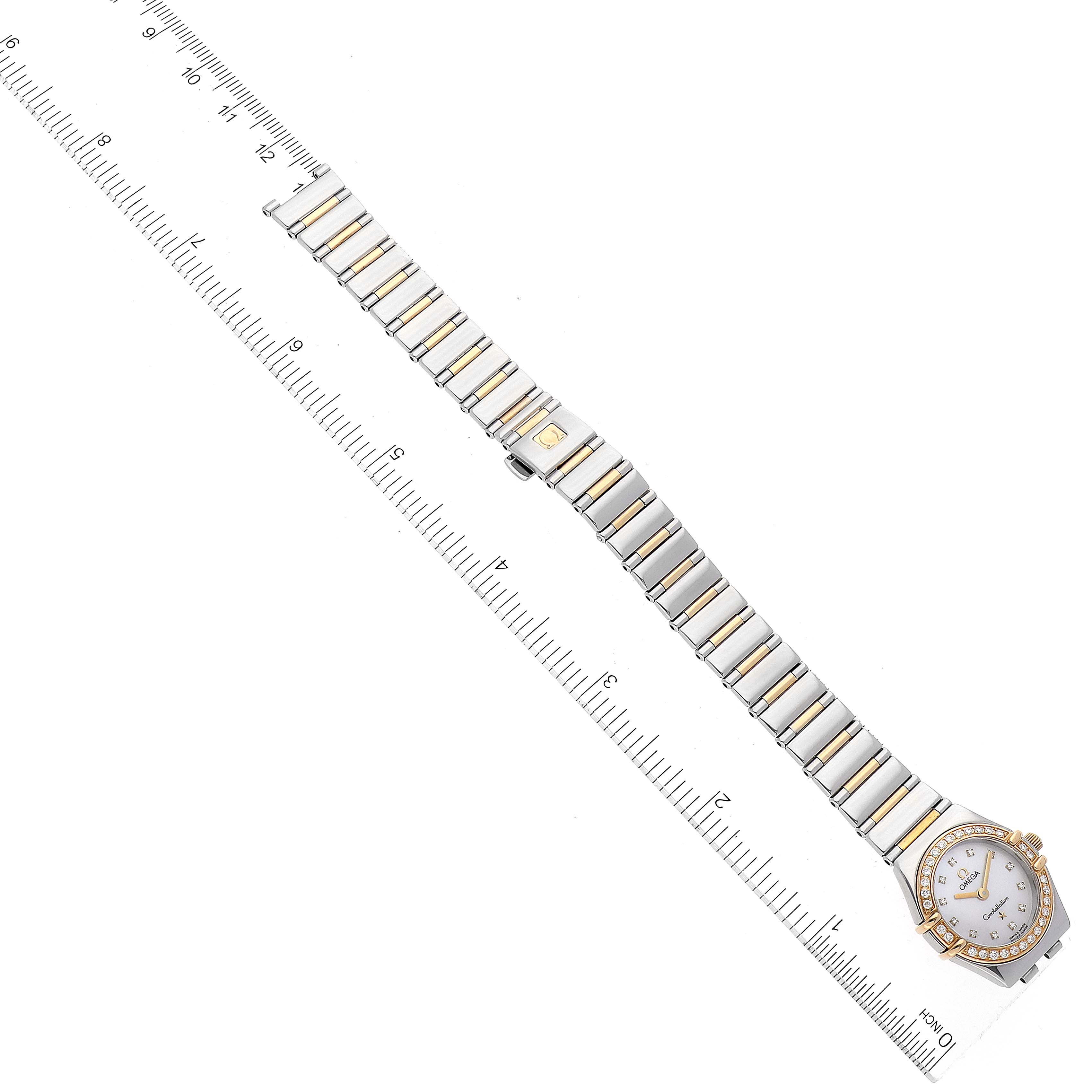 The image shows the Omega 1365.75.00 Women's Steel and Gold (two tone) Mother of Pearl Dial 1365.75.00 Women's Steel and Gold (two tone) Mother of Pearl Dial Constellation MOP Dial Steel Yellow Gold Diamond Ladies Watch 1365.75.00 lying flat with a measuring ruler beside it.