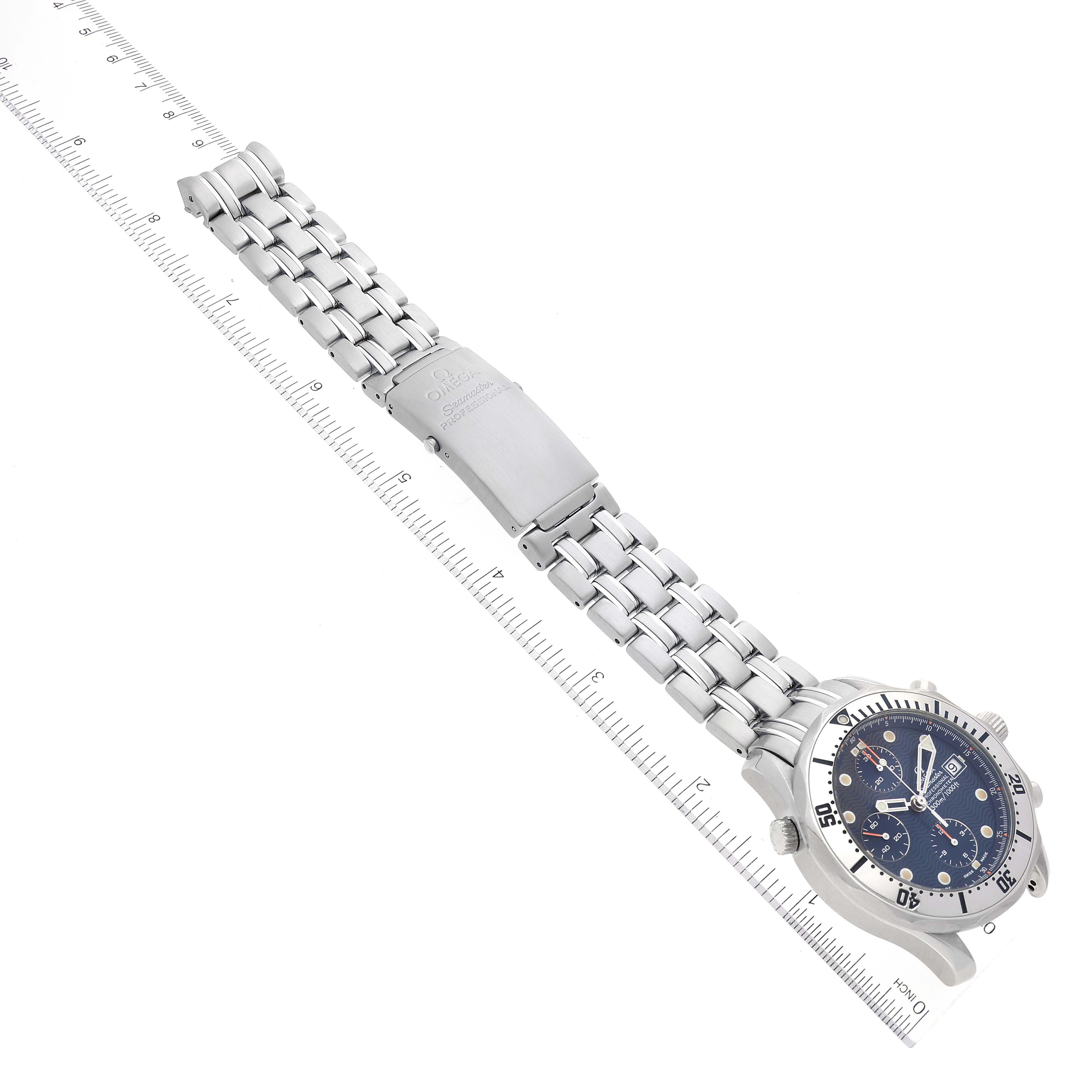 The image shows an Omega Seamaster 2598.80.00 Men's Stainless Steel Blue Dial 2598.80.00 Men's Stainless Steel Blue Dial watch at an angled perspective, featuring the watch face, bezel, and entire bracelet, placed next to a ruler.