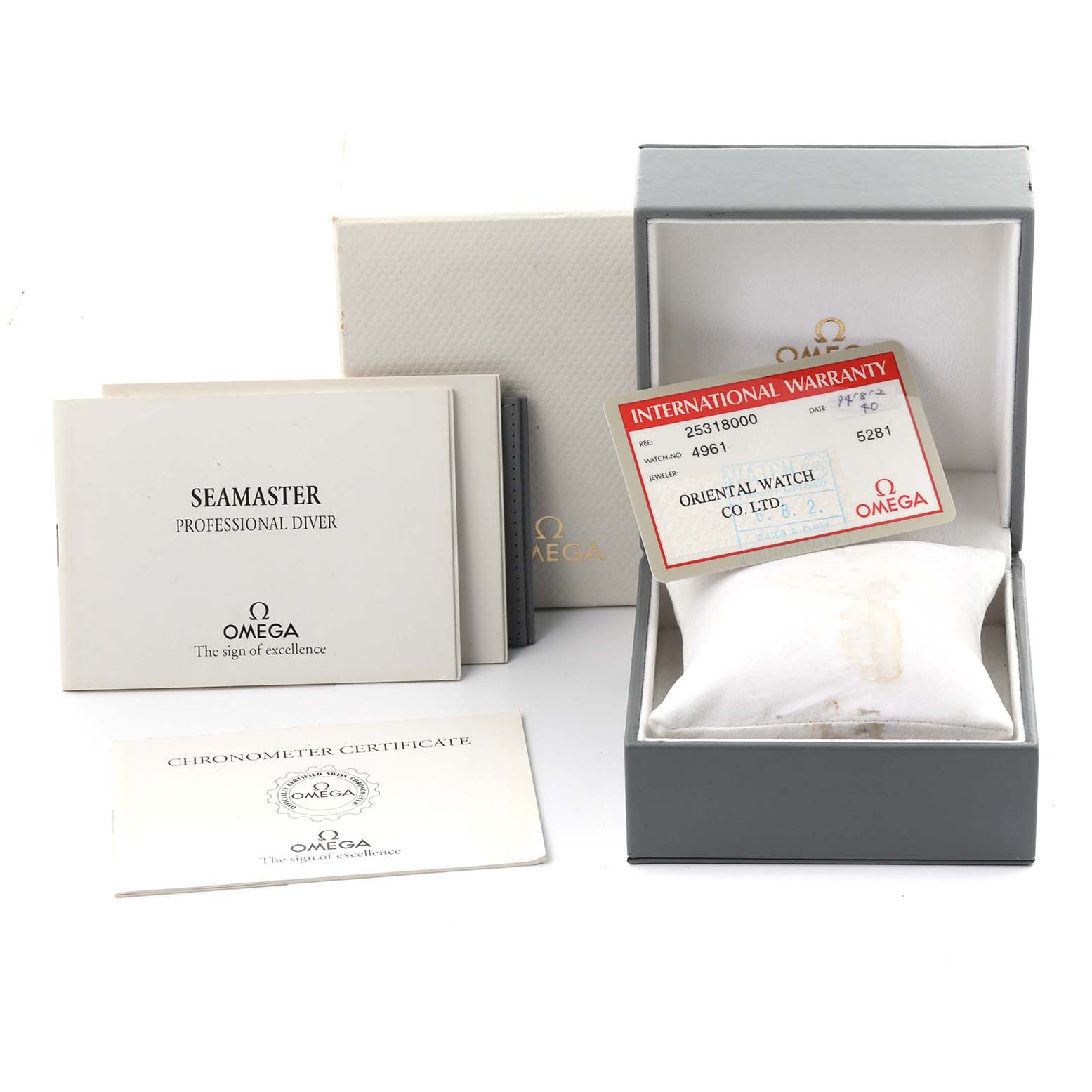 The image shows an Omega Seamaster 2531.80.00 Men
s Stainless Steel Blue Dial 2531.80.00 Men
s Stainless Steel Blue Dial box, warranty card, and manuals from a top-down angle.