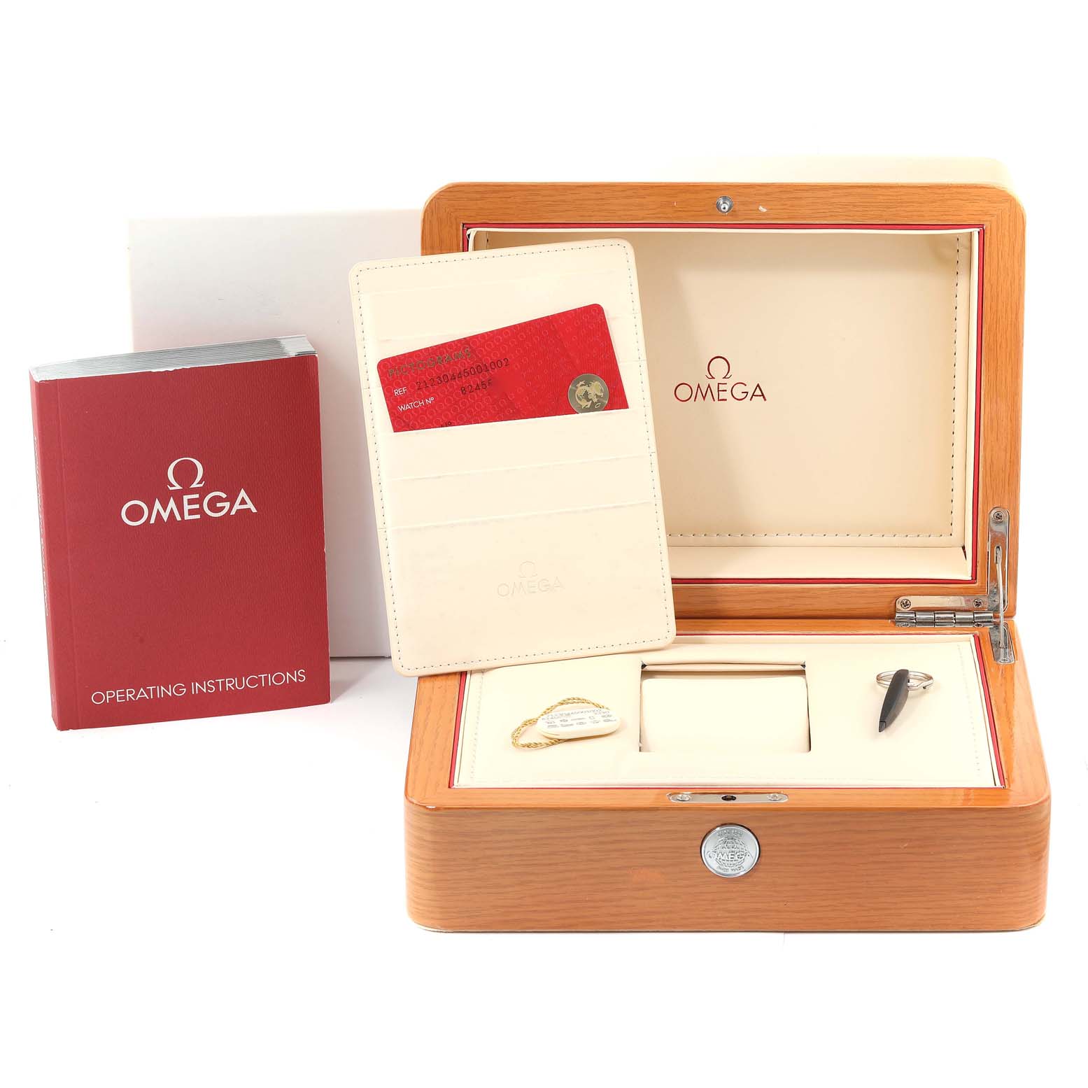 The image shows an Omega Seamaster 212.30.44.50.01.002 Men's Stainless Steel Black Dial 212.30.44.50.01.002 Men's Stainless Steel Black Dial watch's open wooden box with operating instructions and a cardholder.