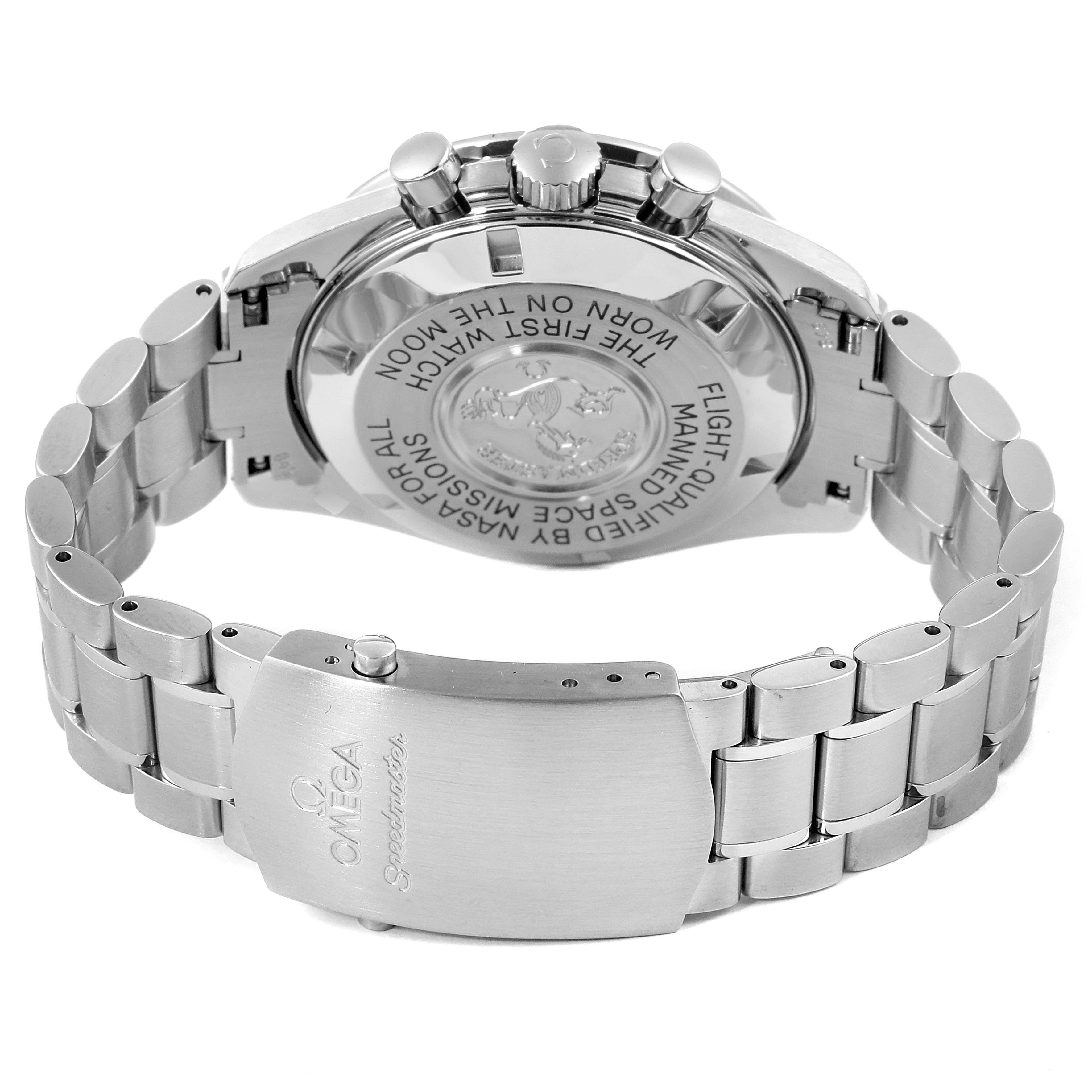 The image shows the back view of an Omega Speedmaster 3570.50.00 Men
s Stainless Steel Black Dial 3570.50.00 Men
s Stainless Steel Black Dial watch, highlighting its clasp, engraved case back, and metal bracelet.