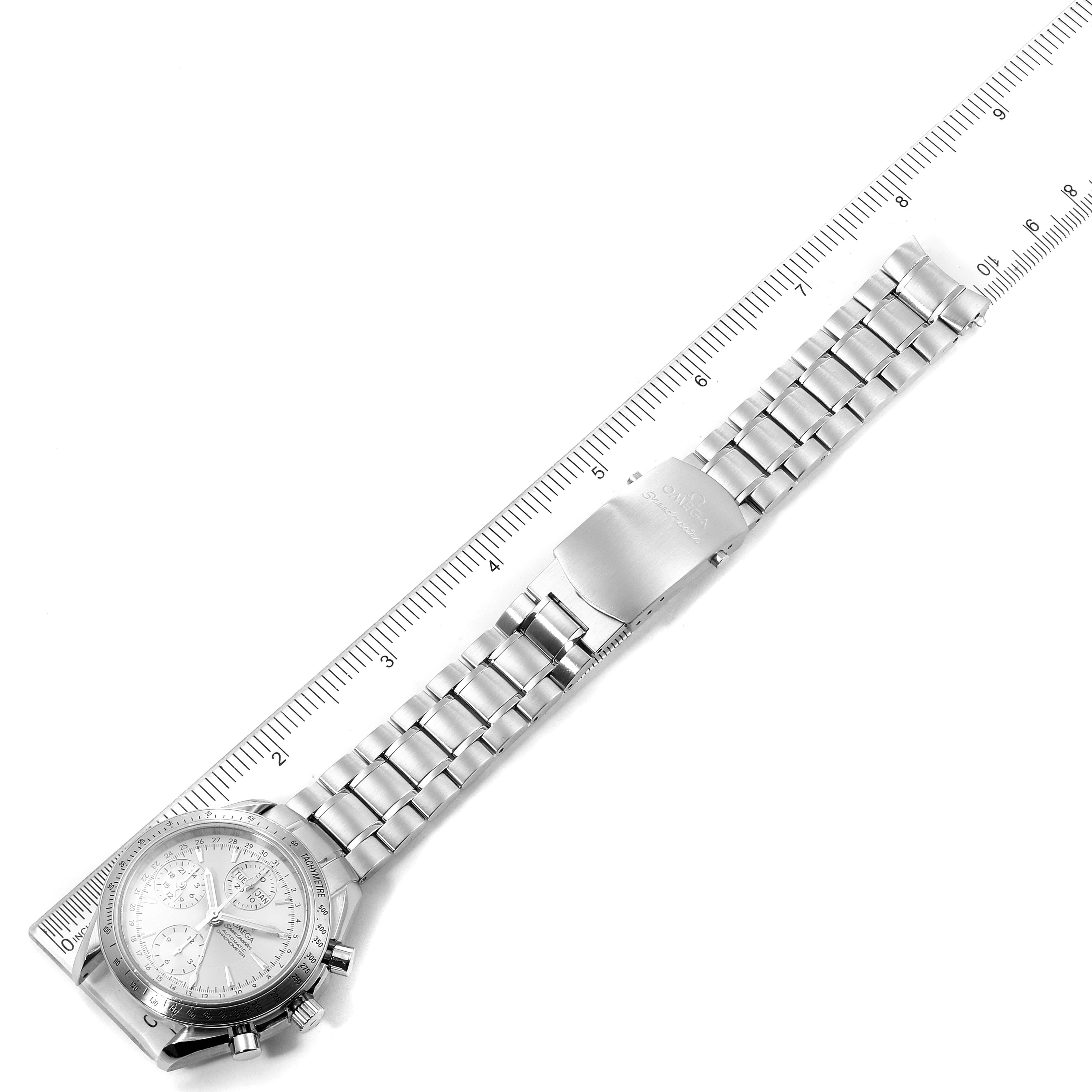 The Omega Speedmaster 3521.30.00 Men's Stainless Steel Silver Dial 3521.30.00 Men's Stainless Steel Silver Dial watch is shown from a top-down angle next to a ruler, highlighting its full bracelet and clasp.