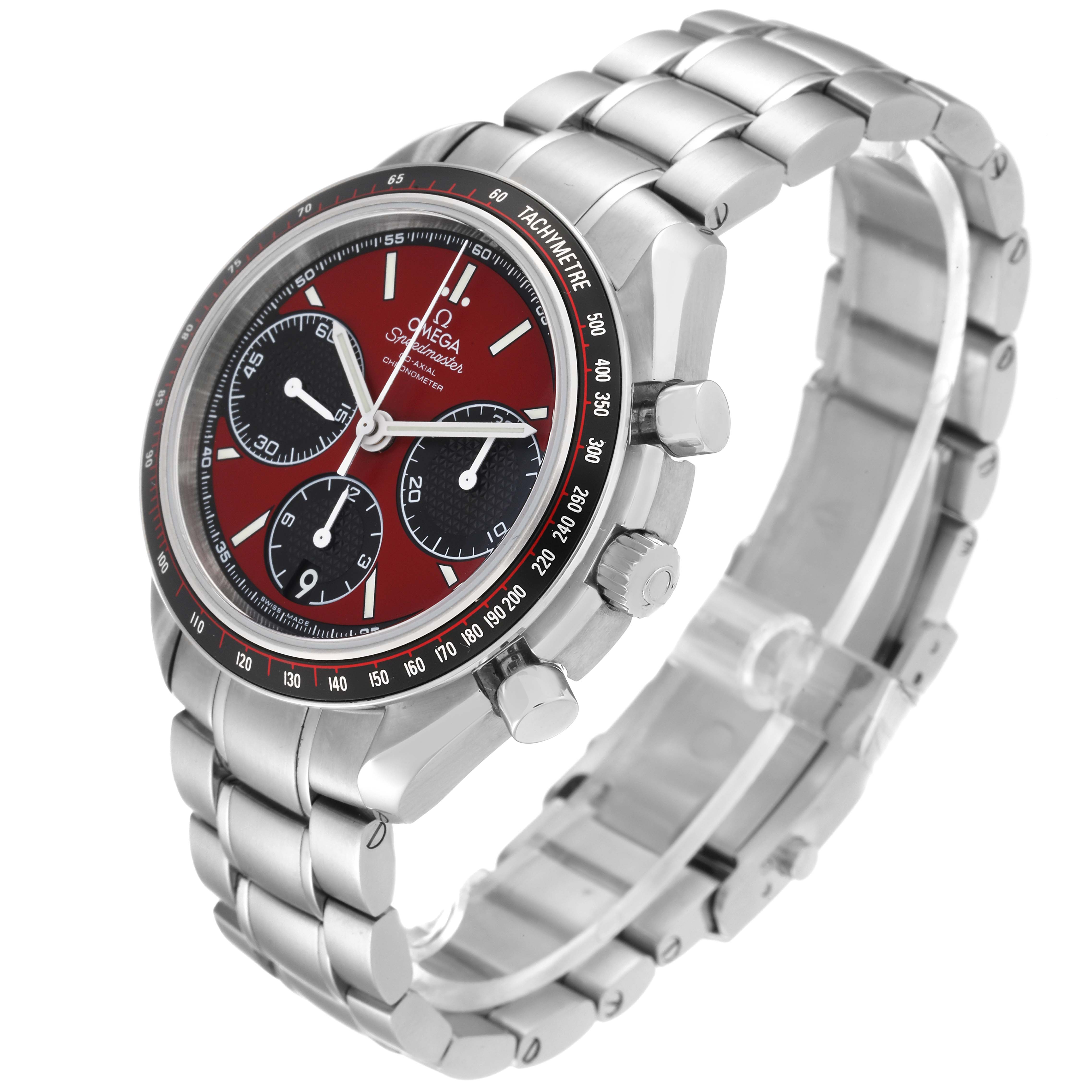 The image shows an angled side and top view of an Omega Speedmaster 326.30.40.50.11.001 Men's Stainless Steel Red Dial 326.30.40.50.11.001 Men's Stainless Steel Red Dial watch, highlighting the dial, tachymeter, and metal bracelet.