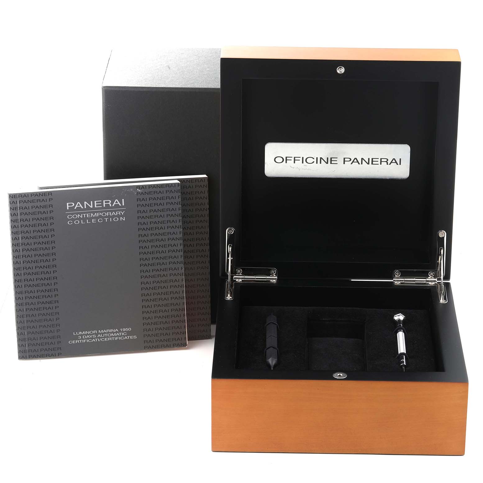 This image shows the open box set of a Panerai Luminor PAM00328 Men's Stainless Steel Black Dial PAM00328 Men's Stainless Steel Black Dial watch, including the manual and watch tools set inside the box.