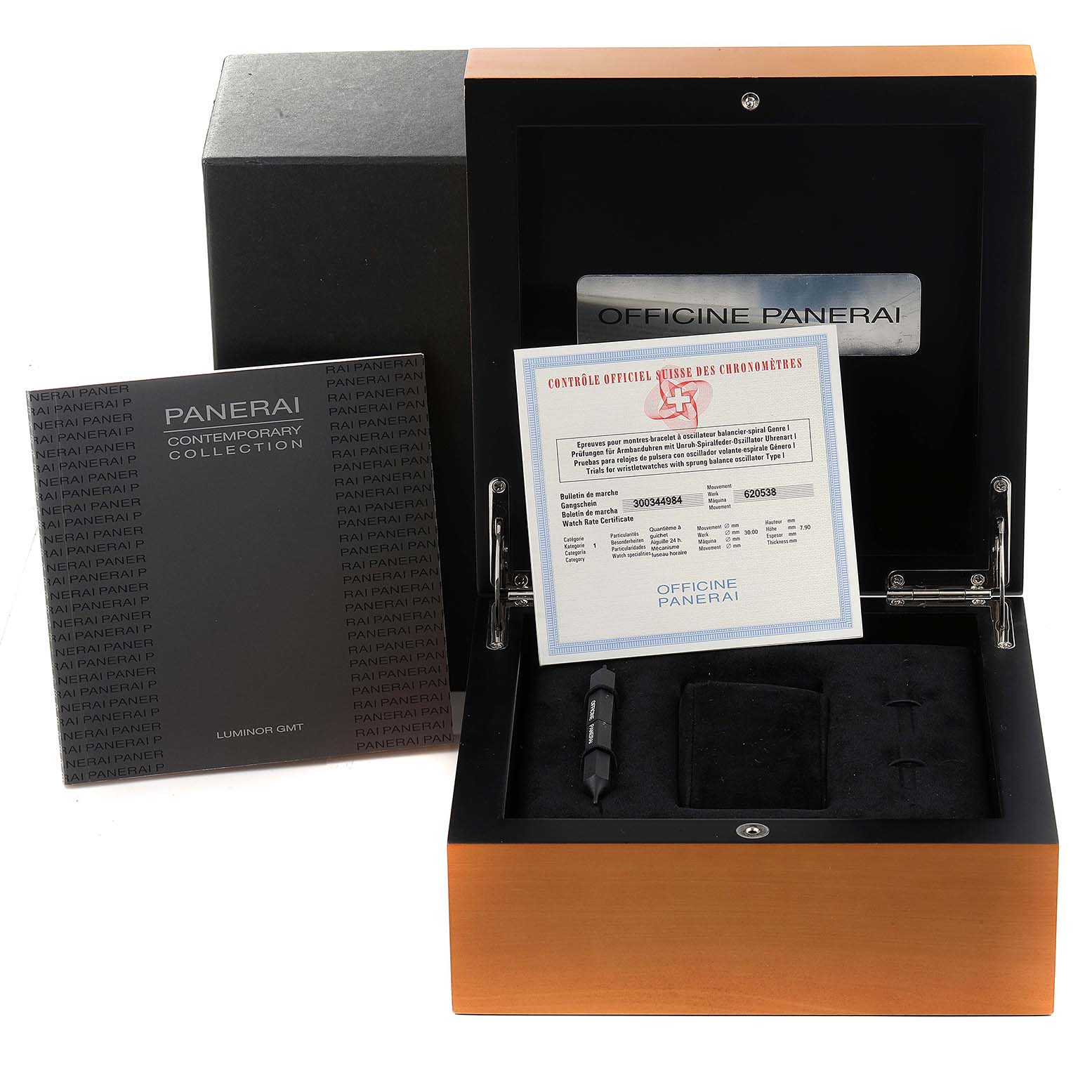 This image shows an opened Panerai Luminor PAM00244 Men
s Stainless Steel Black Dial PAM00244 Men
s Stainless Steel Black Dial watch box with included documentation and tools.