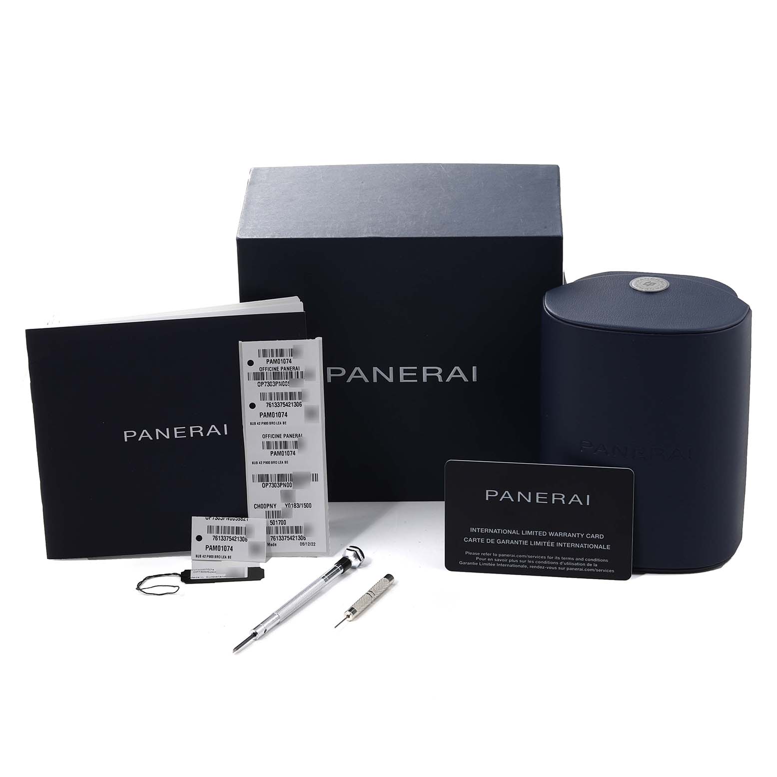 The image shows the packaging, warranty card, tags, instruction manual, and tools for the Panerai Submersible PAM01074 Men's Bronze Blue Dial PAM01074 Men's Bronze Blue Dial watch.