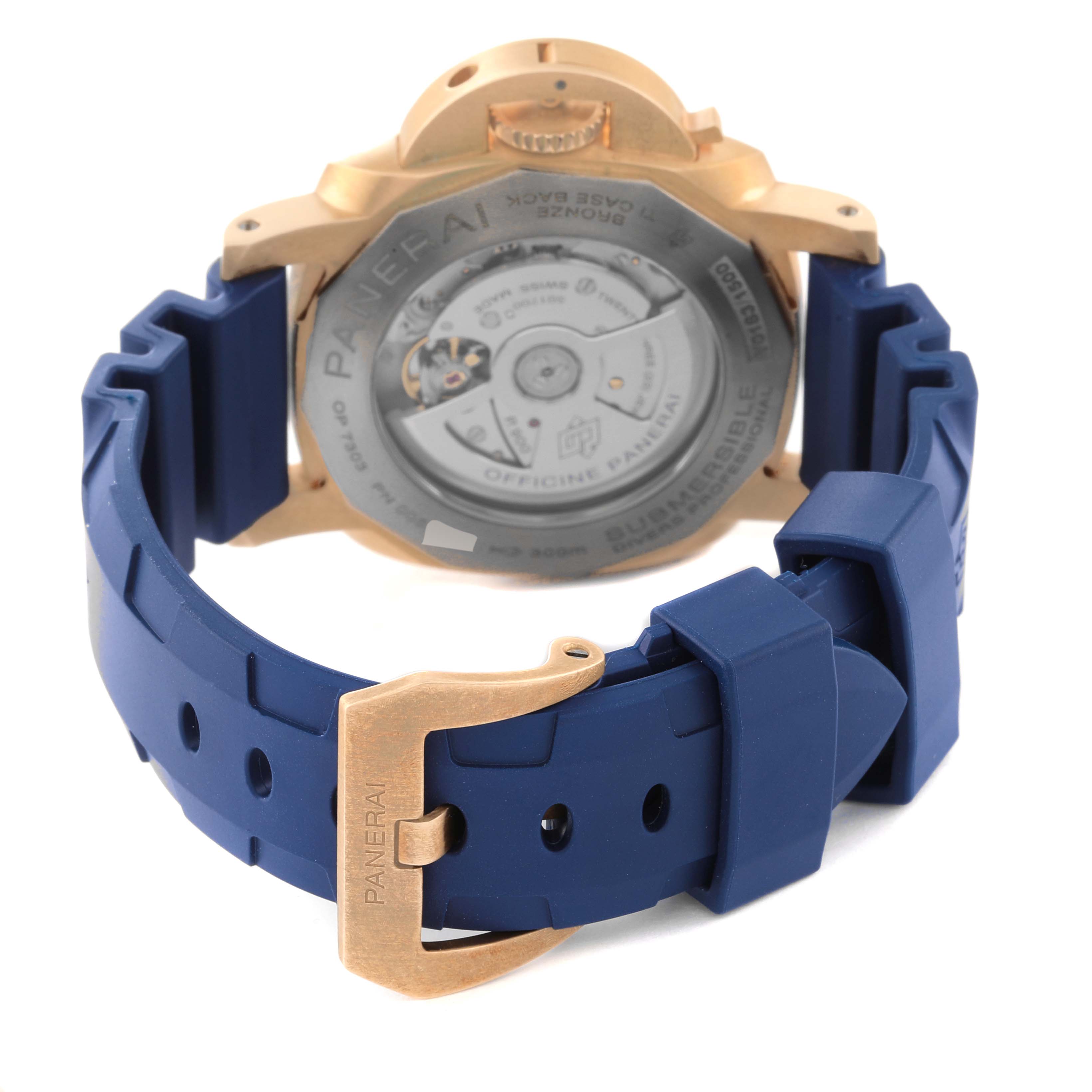 The image shows the back view of a Panerai Submersible PAM01074 Men's Bronze Blue Dial PAM01074 Men's Bronze Blue Dial watch, highlighting the case back and blue rubber strap with a bronze buckle.