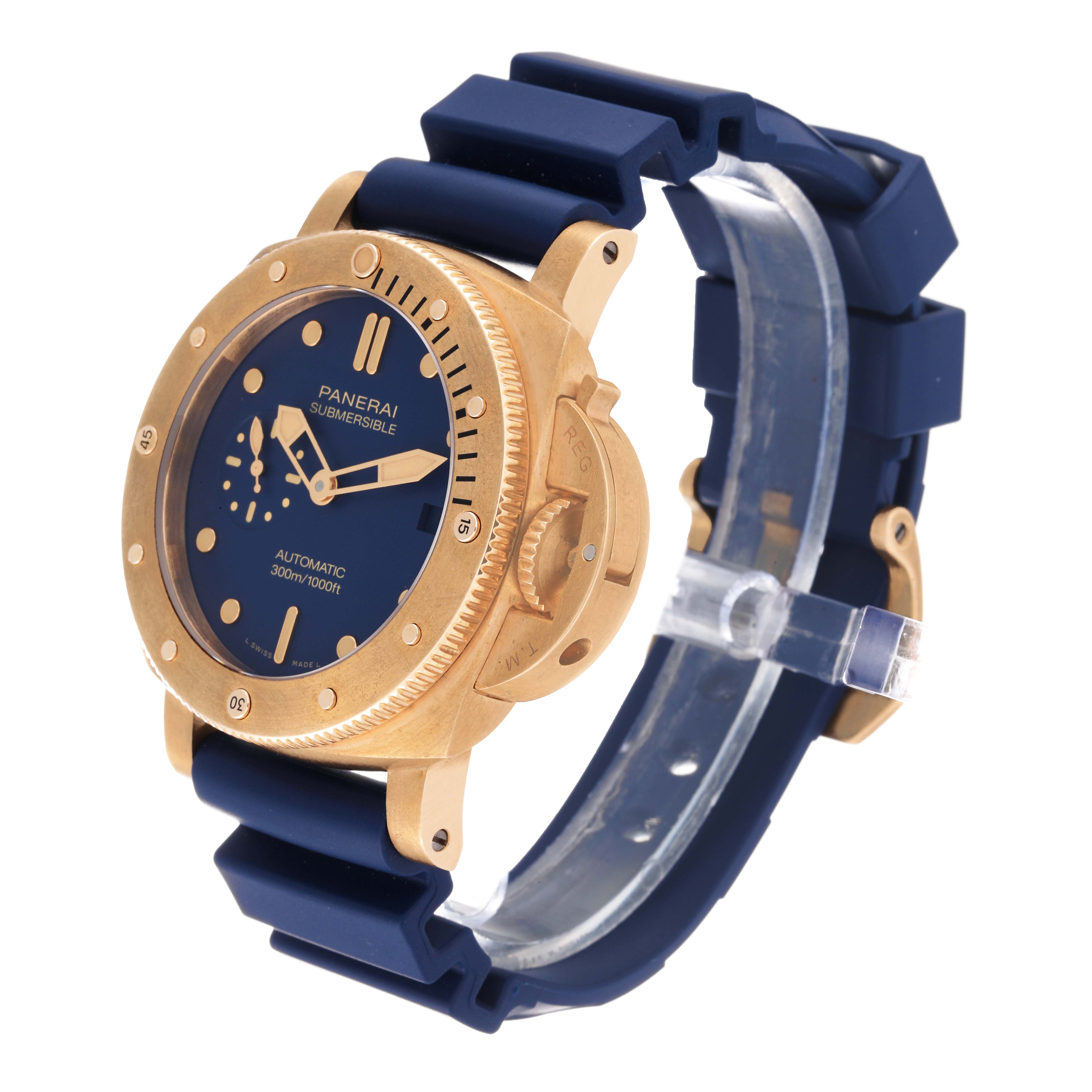 The Panerai Submersible PAM01074 Men's Bronze Blue Dial PAM01074 Men's Bronze Blue Dial watch is shown at a three-quarter angle, displaying its face, bezel, and strap.