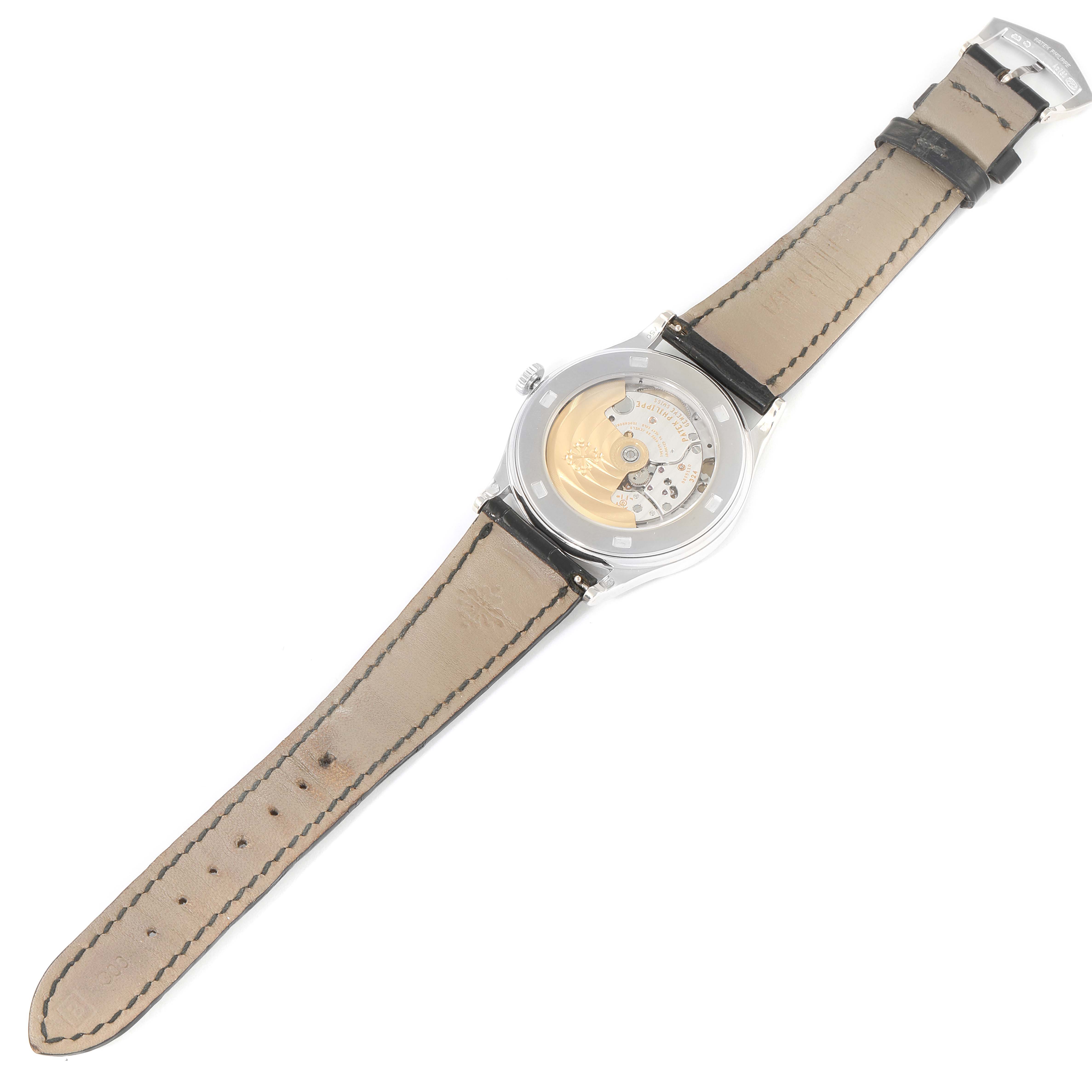 The image shows the back view of a Patek Philippe Calatrava 5297G Men's White Gold Black Dial 5297G Men's White Gold Black Dial model watch, highlighting its open case back and movement.