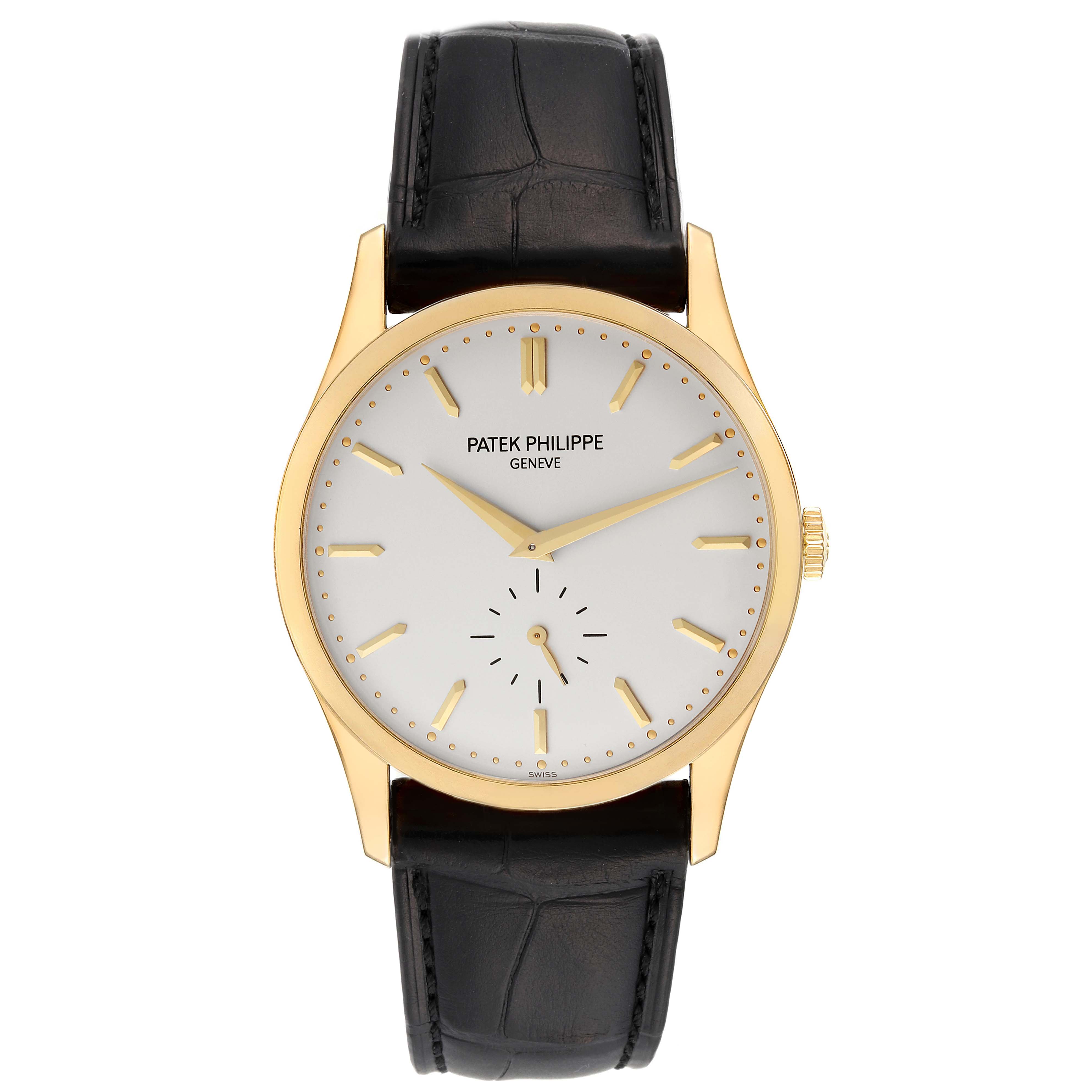 This image shows a front view of a Patek Philippe Calatrava 5196J Men's Yellow Gold Silver Dial 5196J Men's Yellow Gold Silver Dial watch, featuring its dial, hands, casing, and black leather strap.
