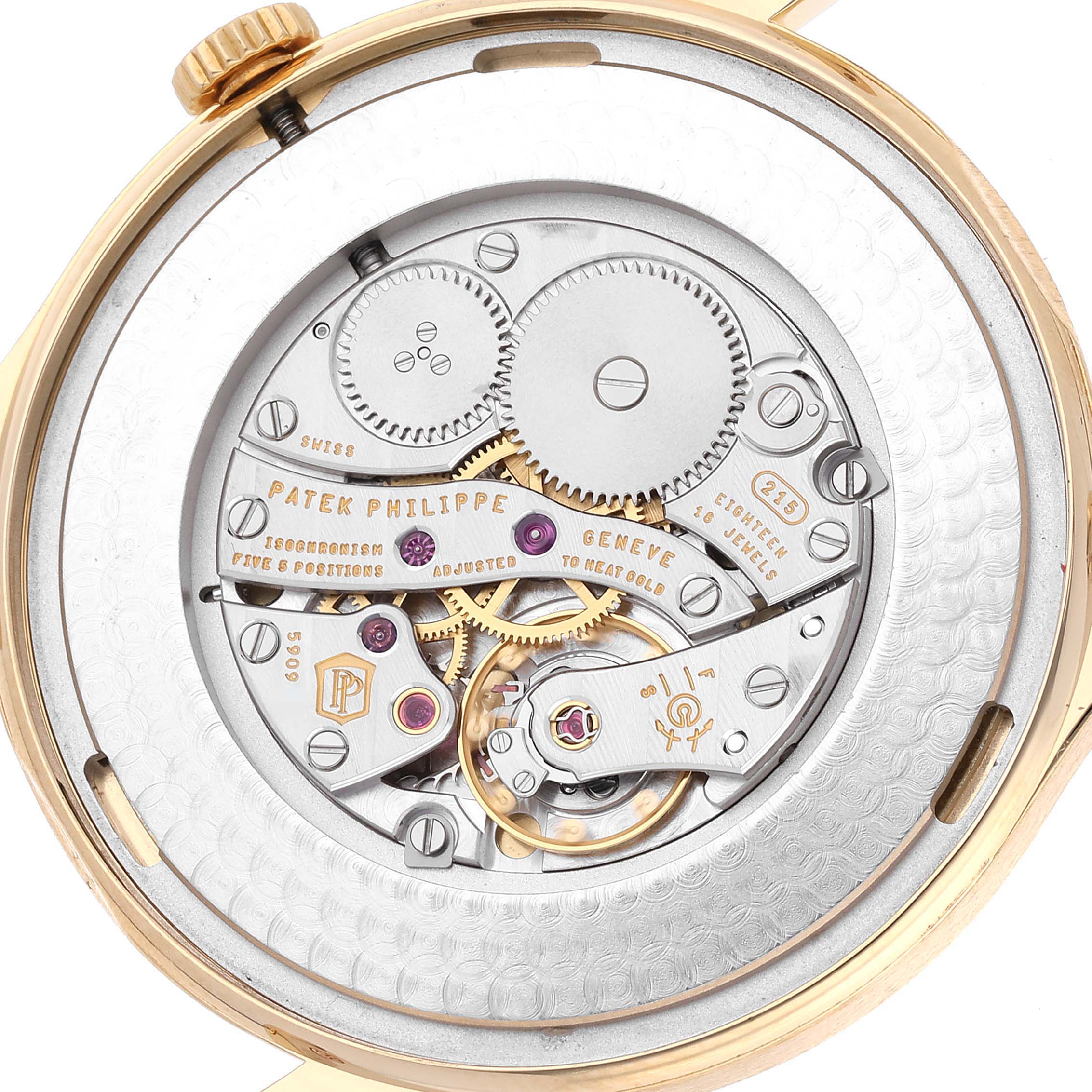This image shows the back view of a Patek Philippe Calatrava 5196J Men's Yellow Gold Silver Dial 5196J Men's Yellow Gold Silver Dial watch, revealing its intricate mechanical movement.