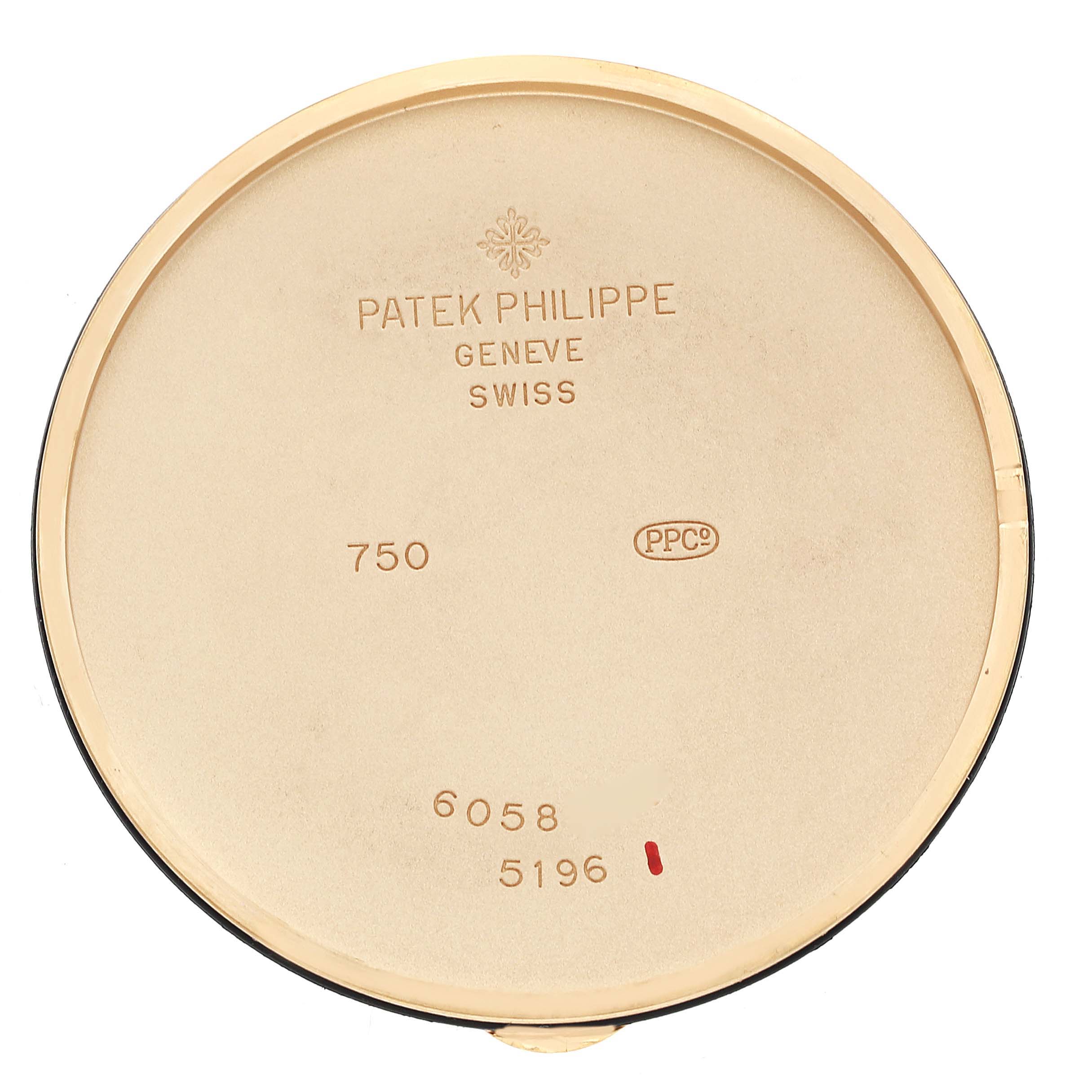 This is the back case of a Calatrava model watch by Patek Philippe, showing its inscriptions and markings.