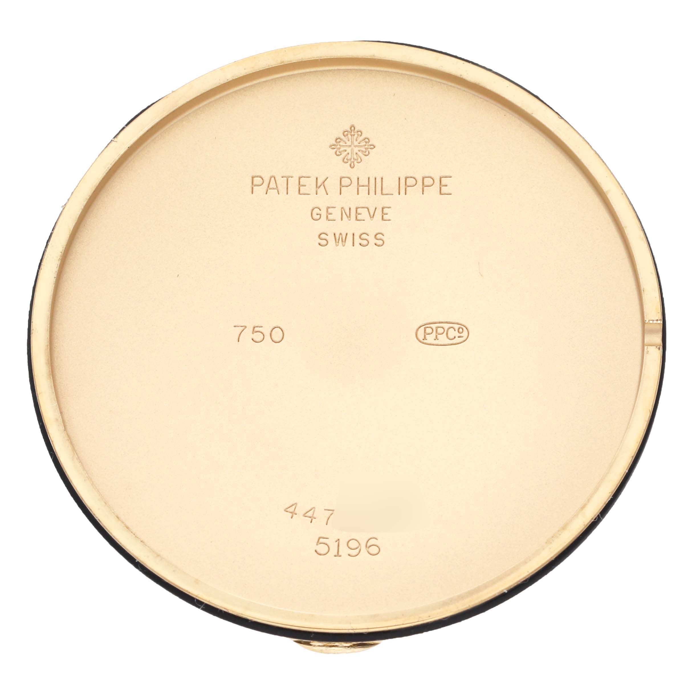 The image shows the inner case back of a Patek Philippe Calatrava 5196J Men's Yellow Gold Silver Dial 5196J Men's Yellow Gold Silver Dial watch, displaying the brand and model details.