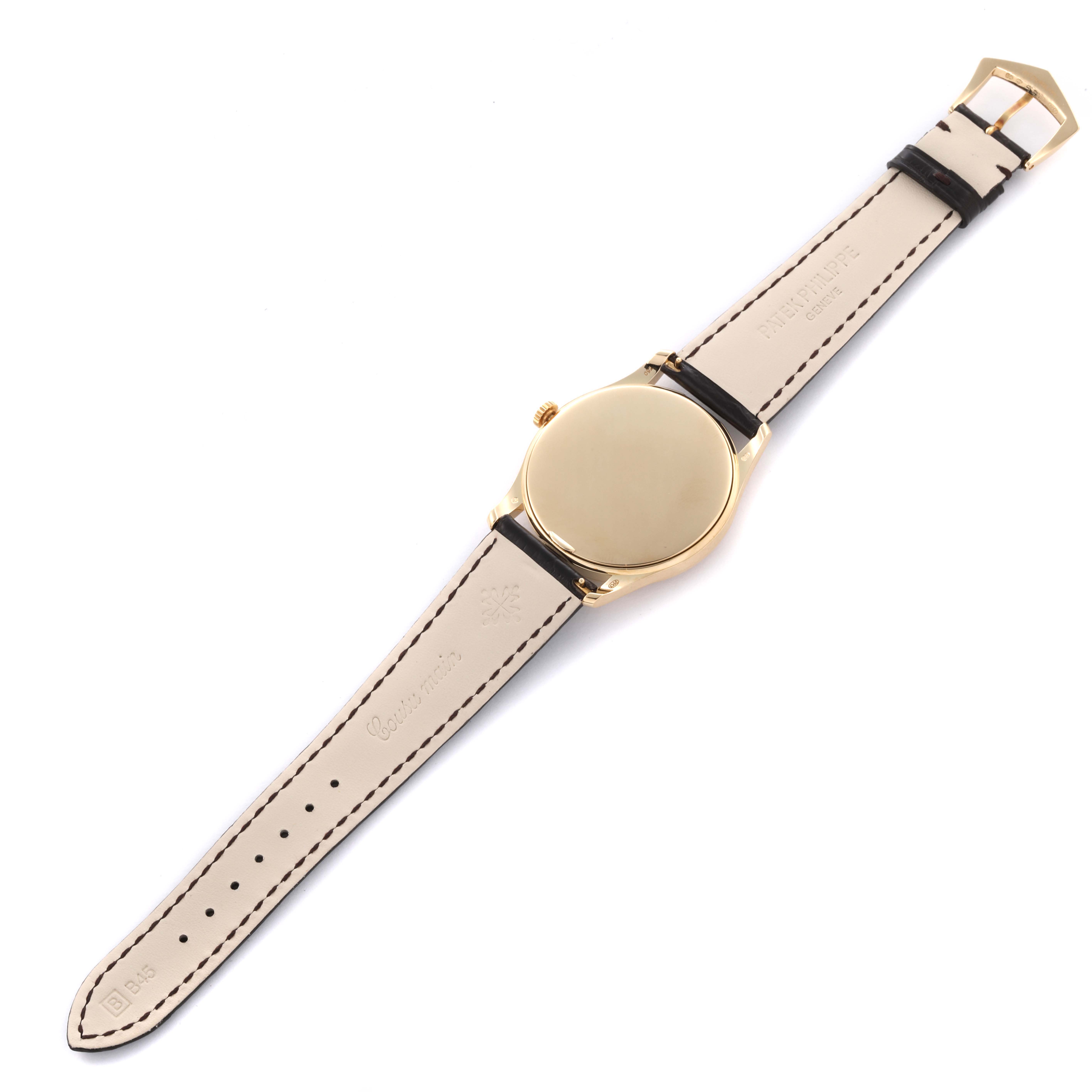 The image shows the back of a Patek Philippe Calatrava 5196J Men's Yellow Gold Silver Dial 5196J Men's Yellow Gold Silver Dial watch, highlighting the case and leather strap.