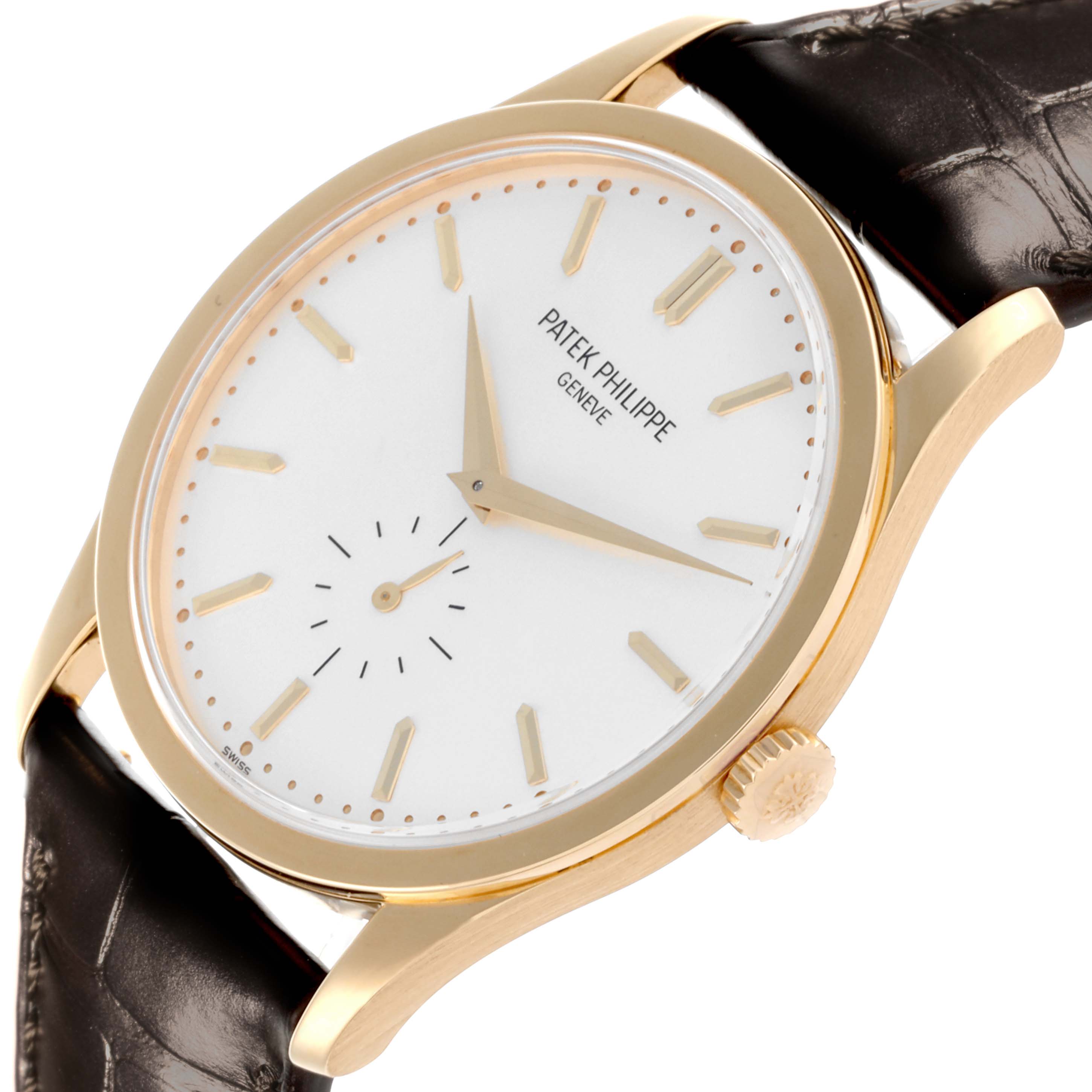 The image shows a Patek Philippe Calatrava 5196J-001 Men's Yellow Gold Silver Dial 5196J-001 Men's Yellow Gold Silver Dial watch at a three-quarter angle, highlighting the face, case, crown, and strap.