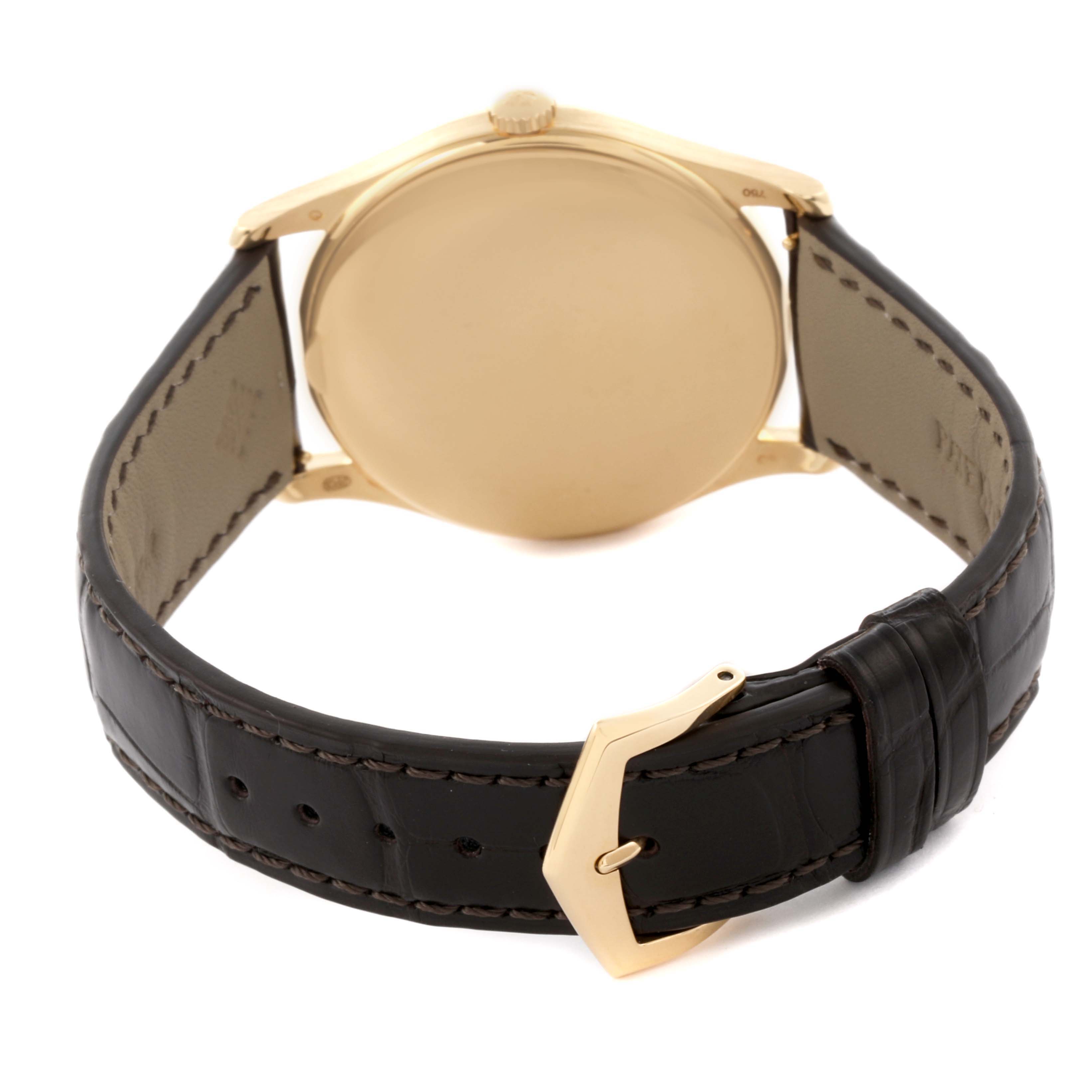 The image shows the back view of a Patek Philippe Calatrava 5196J-001 Men's Yellow Gold Silver Dial 5196J-001 Men's Yellow Gold Silver Dial watch, highlighting the case, lugs, leather strap, and buckle.