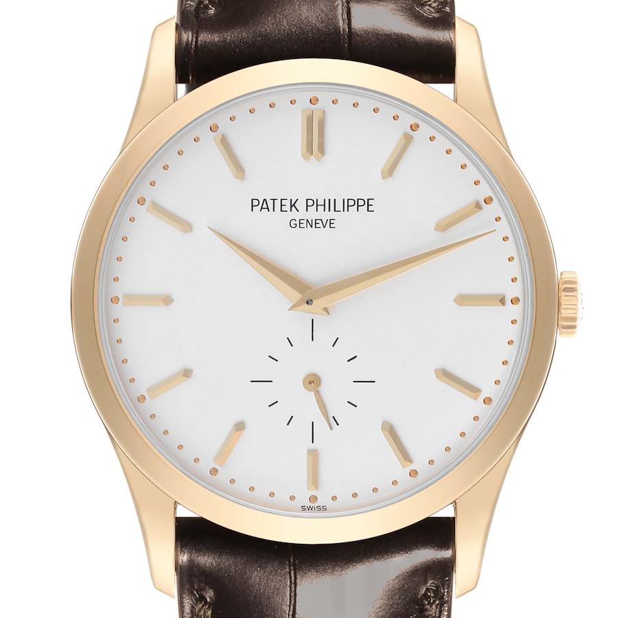 The Patek Philippe Calatrava watch is shown from the front, displaying the dial, hands, and part of the leather strap.