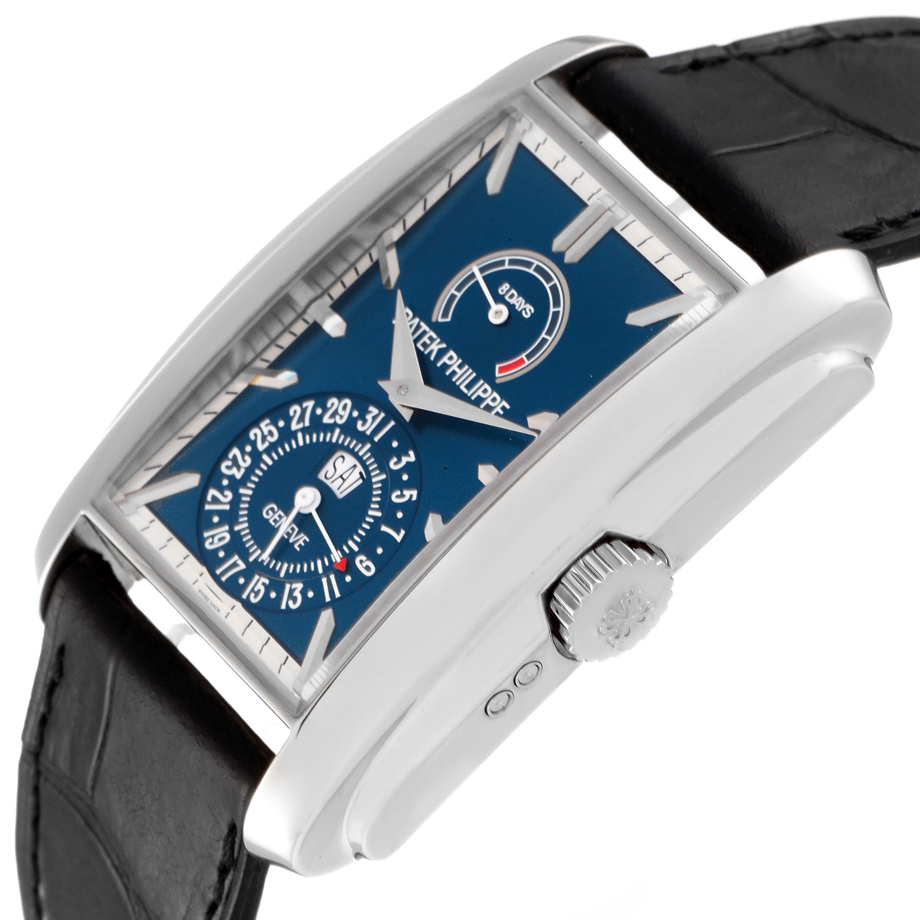 This Patek Philippe Gondolo 5200G-010 Men
s White Gold Blue Dial 5200G-010 Men
s White Gold Blue Dial watch is shown from a side angle, highlighting the face, crown, and part of the strap.