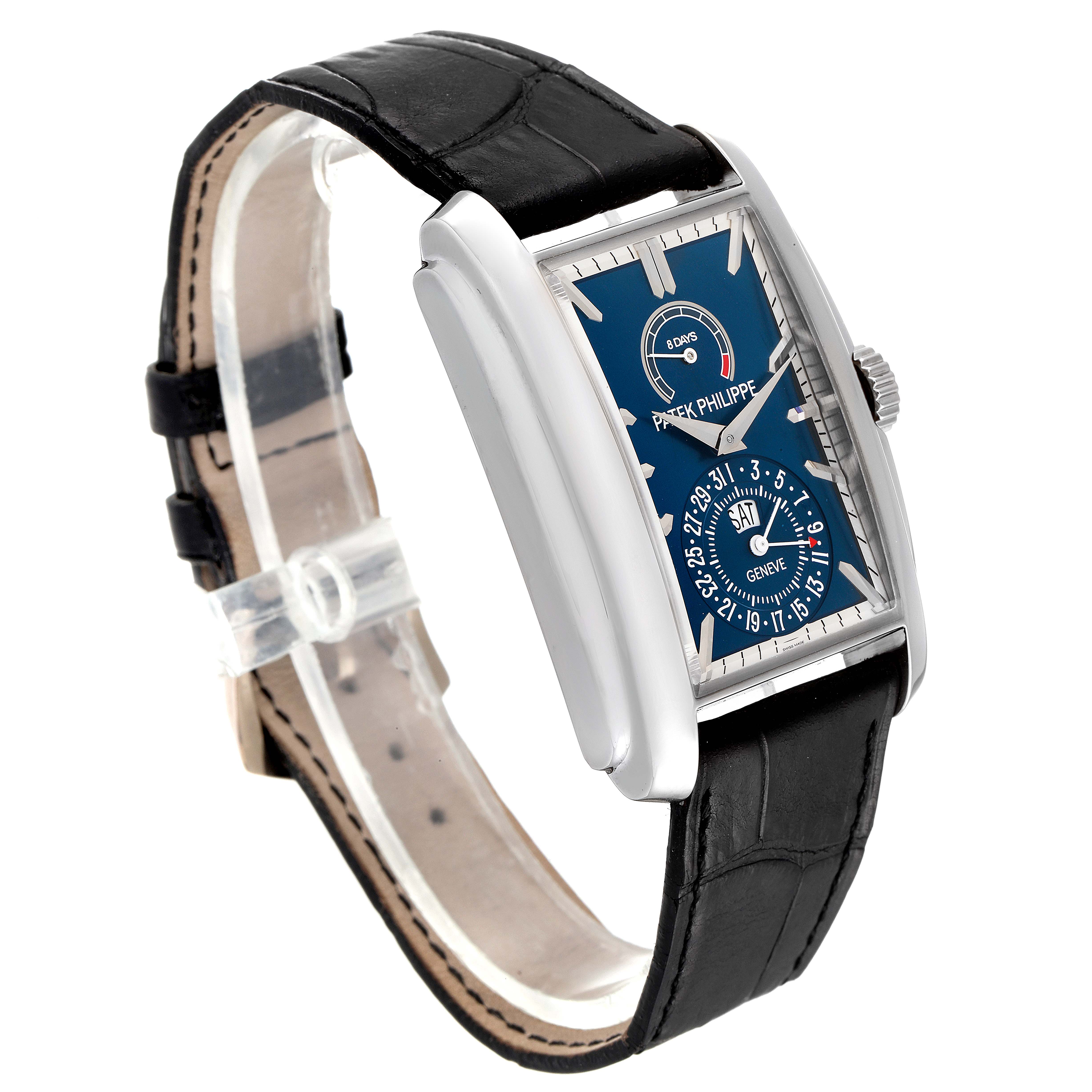 The image shows a Patek Philippe Gondolo 5200G-010 Men
s White Gold Blue Dial 5200G-010 Men
s White Gold Blue Dial watch at a slight angle, highlighting its rectangular face, dial details, and leather strap.