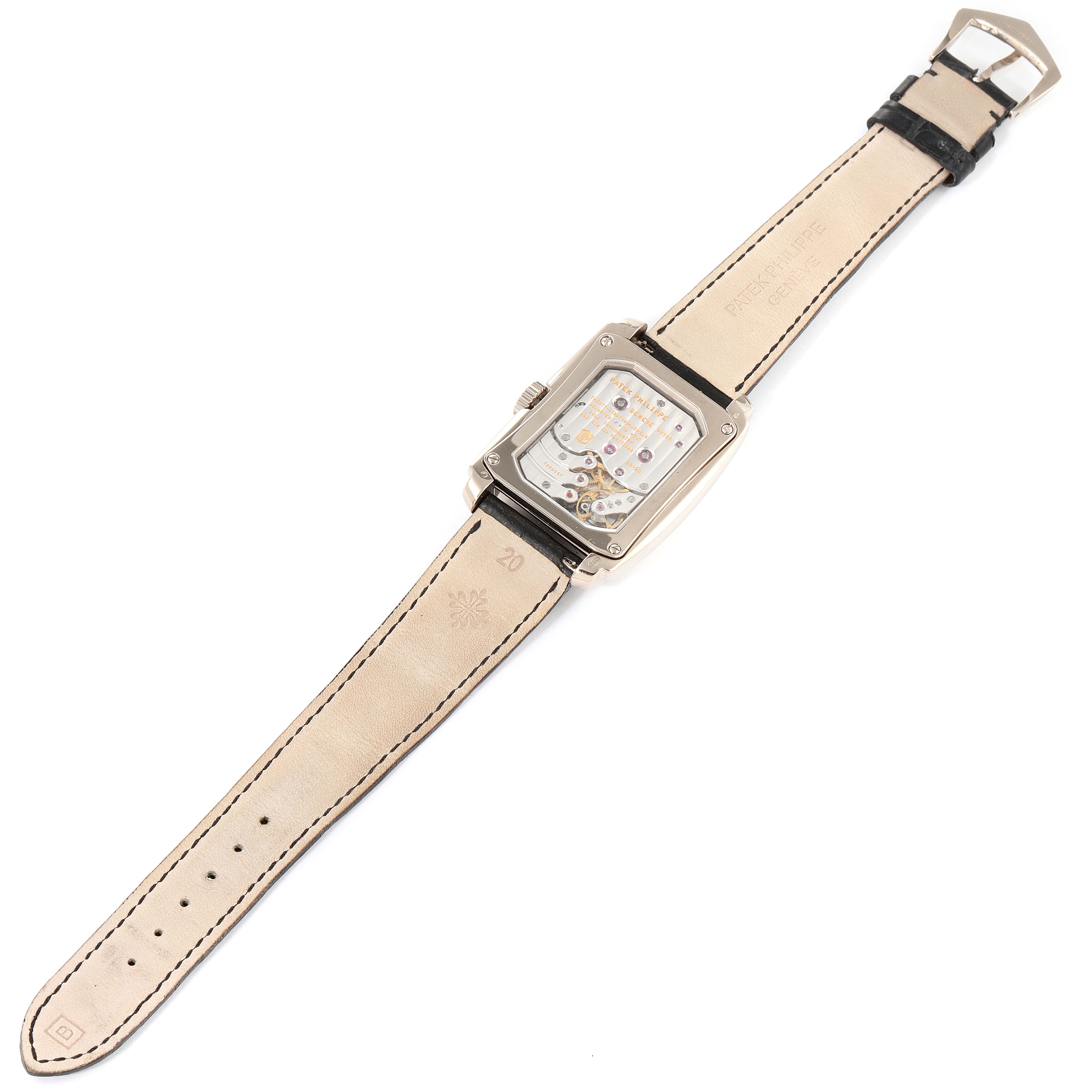 The image shows the back view of the Patek Philippe Gondolo 5200G-010 Men
s White Gold Blue Dial 5200G-010 Men
s White Gold Blue Dial watch, highlighting its mechanical movement and leather strap.