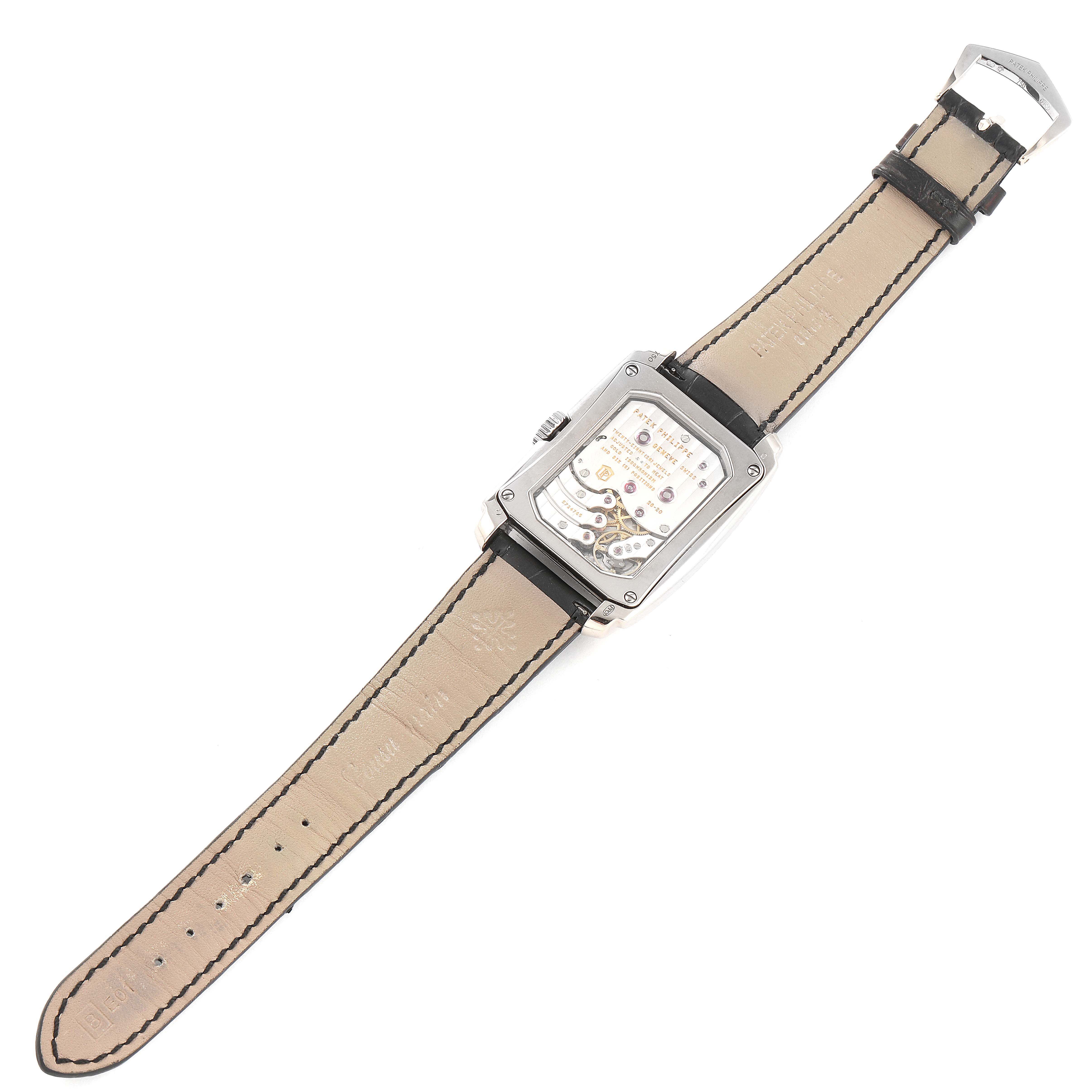 The image shows the back view of a Patek Philippe Gondolo 5200G-010 Men's White Gold Silver Dial 5200G-010 Men's White Gold Silver Dial watch, displaying its movement and leather strap.