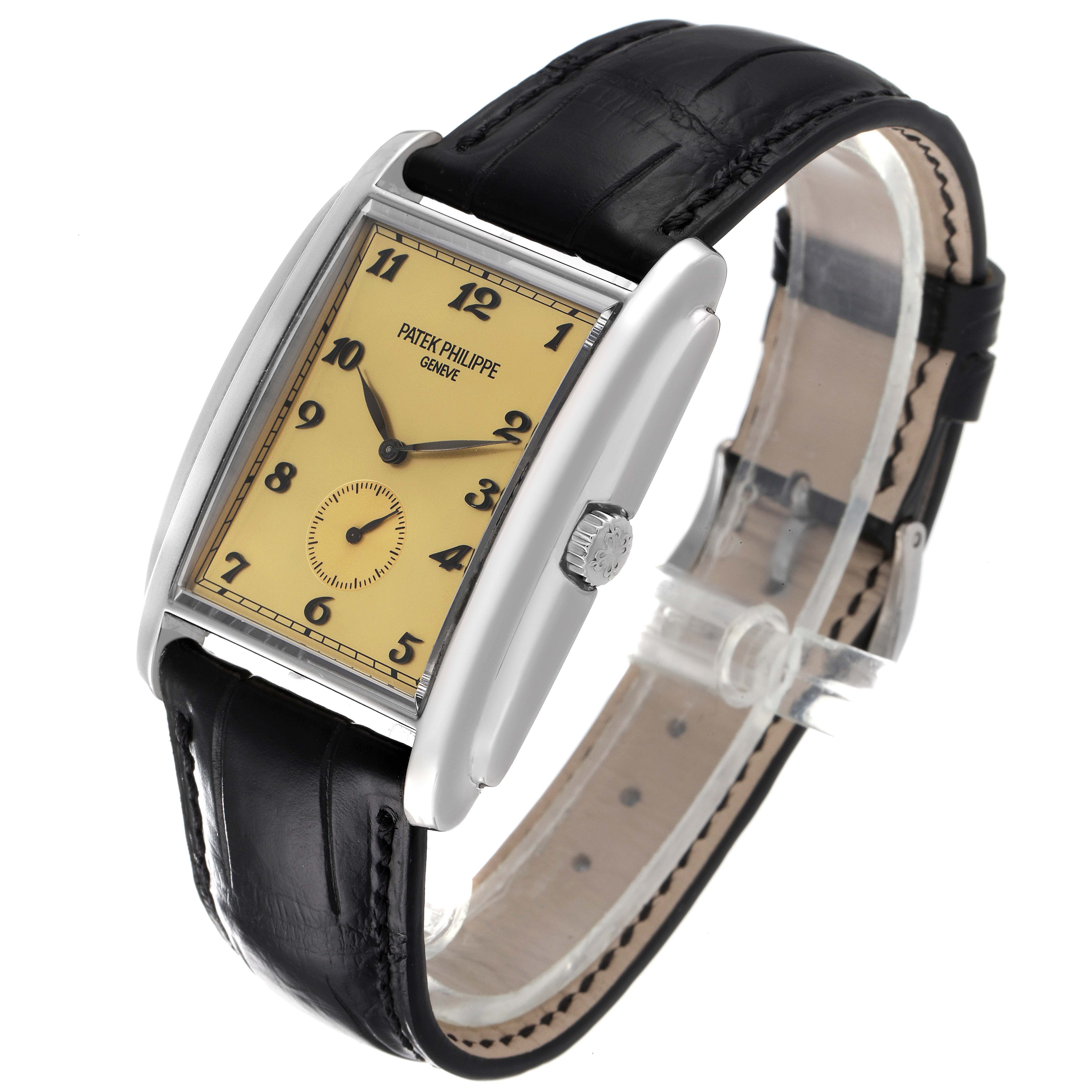 The image shows a Patek Philippe Gondolo 5124G Men's White Gold Champagne Dial 5124G Men's White Gold Champagne Dial watch at an angle showcasing its face, crown, and leather strap.