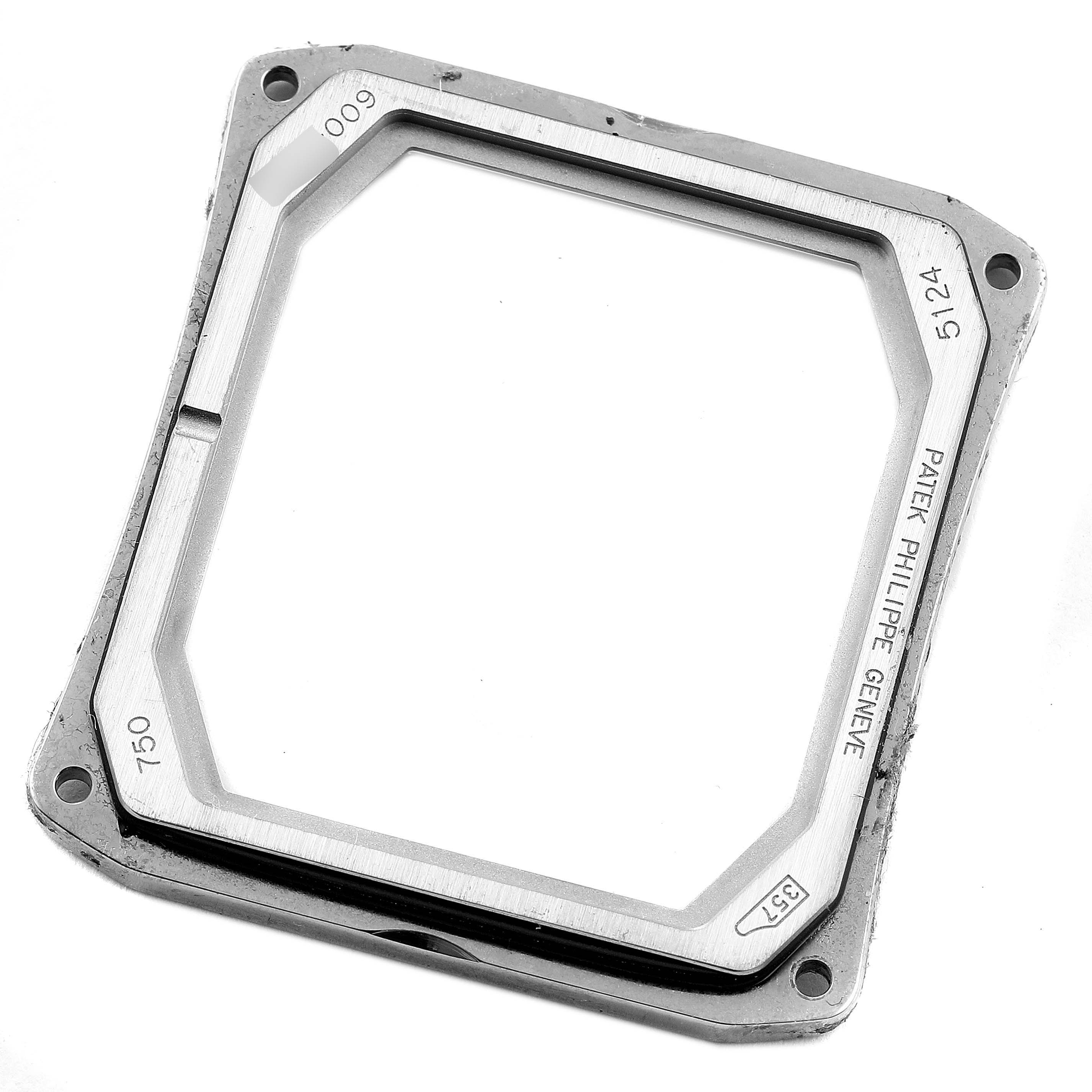 This image shows a Patek Philippe Gondolo 5124G Men's White Gold Pink Dial 5124G Men's White Gold Pink Dial watch bezel from a top-down perspective.