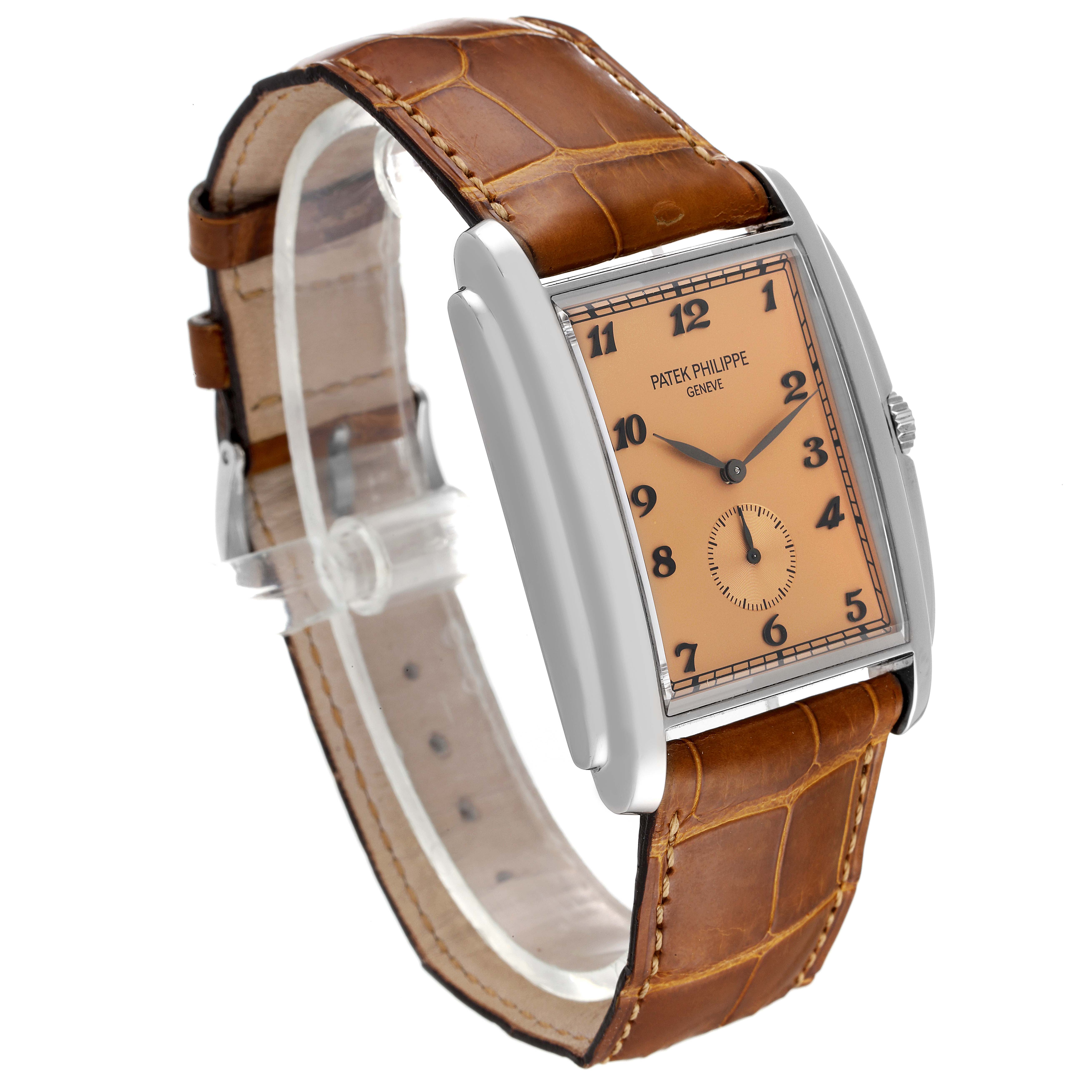 The image shows a side-angle view of the Patek Philippe Gondolo 5124G Men's White Gold Pink Dial 5124G Men's White Gold Pink Dial watch, featuring its rectangular face and brown leather strap.