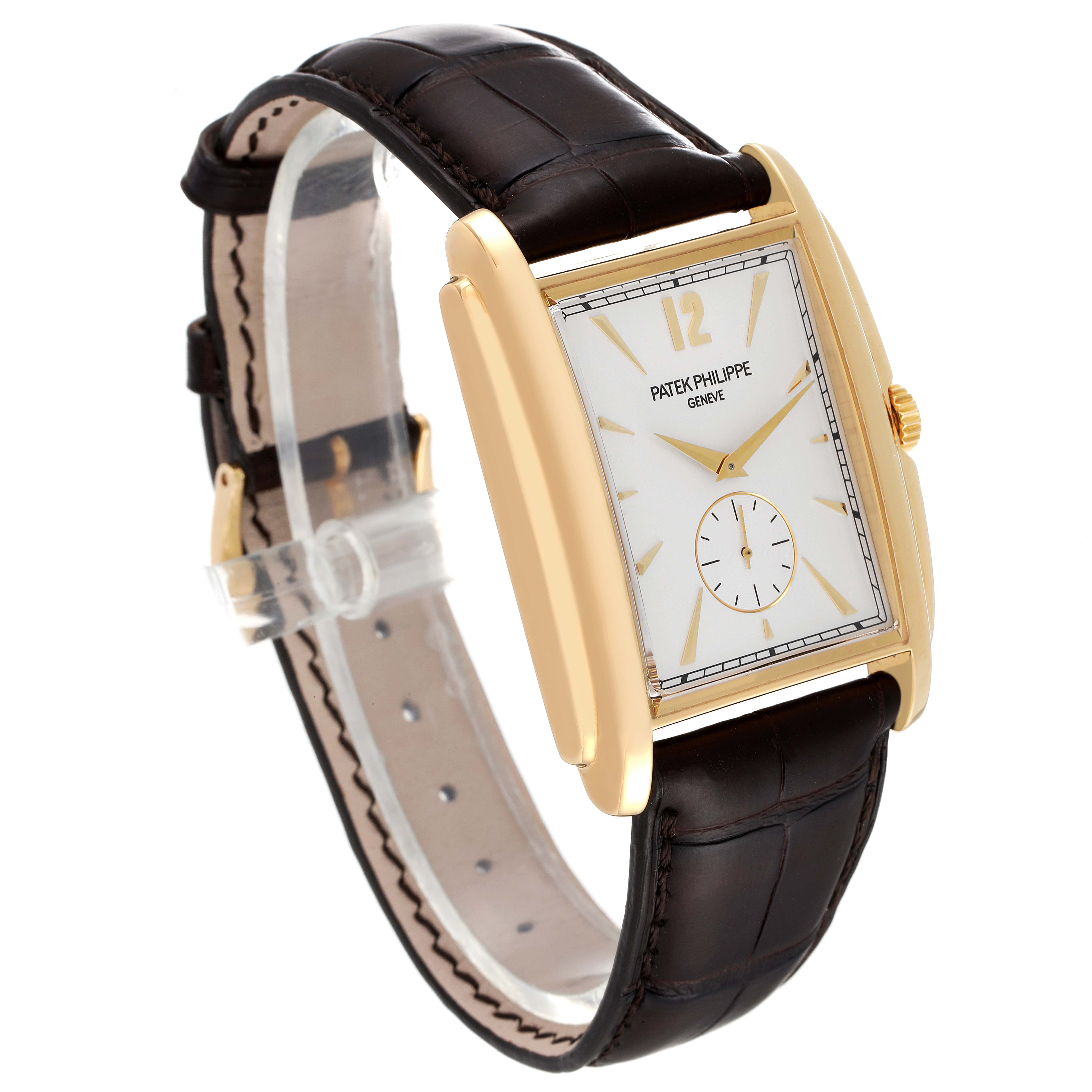 The image shows a frontal side angle of a Patek Philippe Gondolo 5124J Men's Yellow Gold Silver Dial 5124J Men's Yellow Gold Silver Dial watch, displaying its rectangular dial, gold case, and brown leather strap.