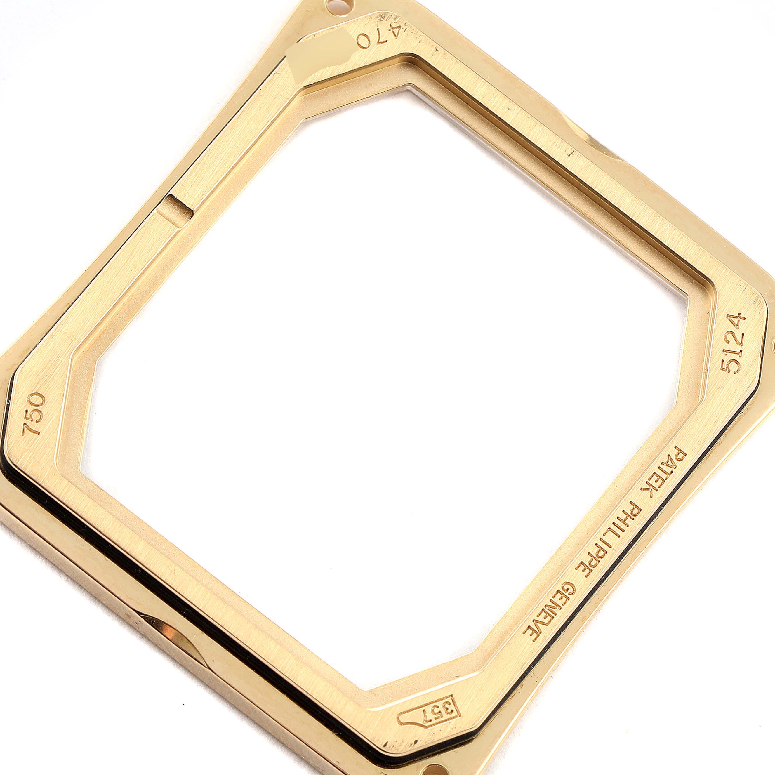 This image shows a gold case bezel for the Patek Philippe Gondolo 5124J Men's Yellow Gold Silver Dial 5124J Men's Yellow Gold Silver Dial model, viewed from an angled top perspective.