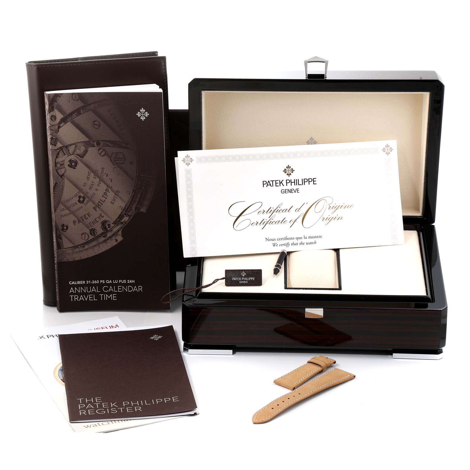 The image shows the accessories for the Patek Philippe Complications 5326G-001 Men's White Gold Grey Dial 5326G-001 Men's White Gold Grey Dial model, including a box, certificates, manuals, and a watch strap.