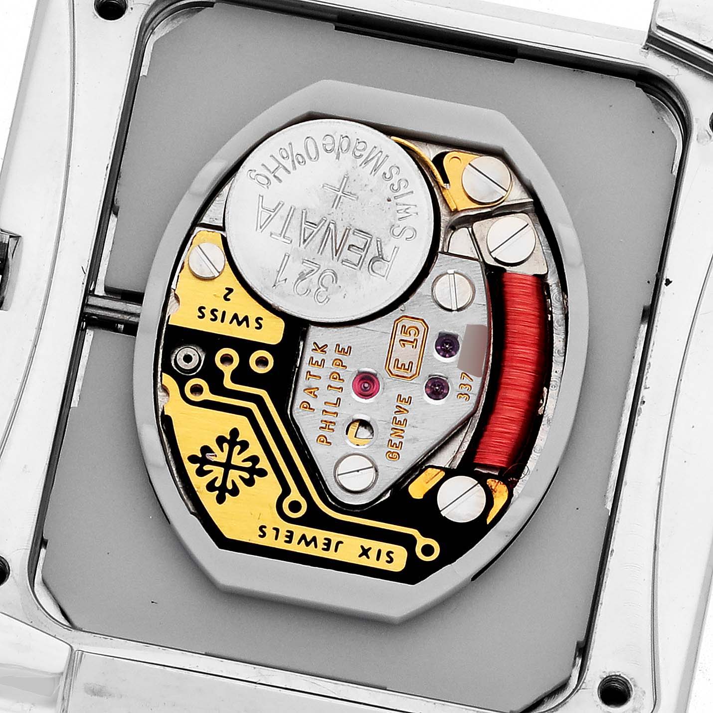 The image shows the movement of a Patek Philippe Twenty-4 4910/10A-001 Women's Stainless Steel Black Dial 4910/10A-001 Women's Stainless Steel Black Dial, highlighting its intricate components from a close-up angle.