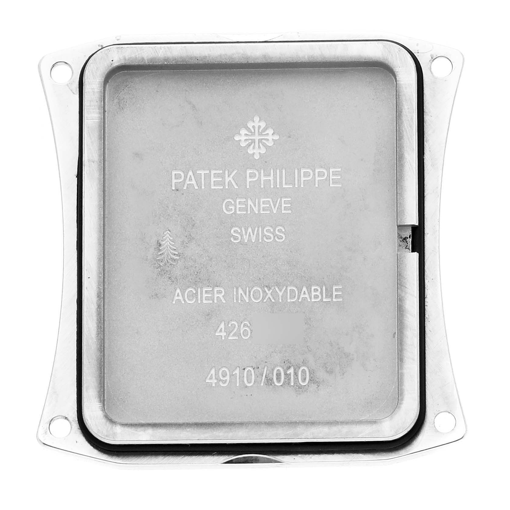 The image shows the back case of a Patek Philippe Twenty-4 4910/10A-001 Women's Stainless Steel Black Dial 4910/10A-001 Women's Stainless Steel Black Dial watch, focusing on its markings and inscriptions.
