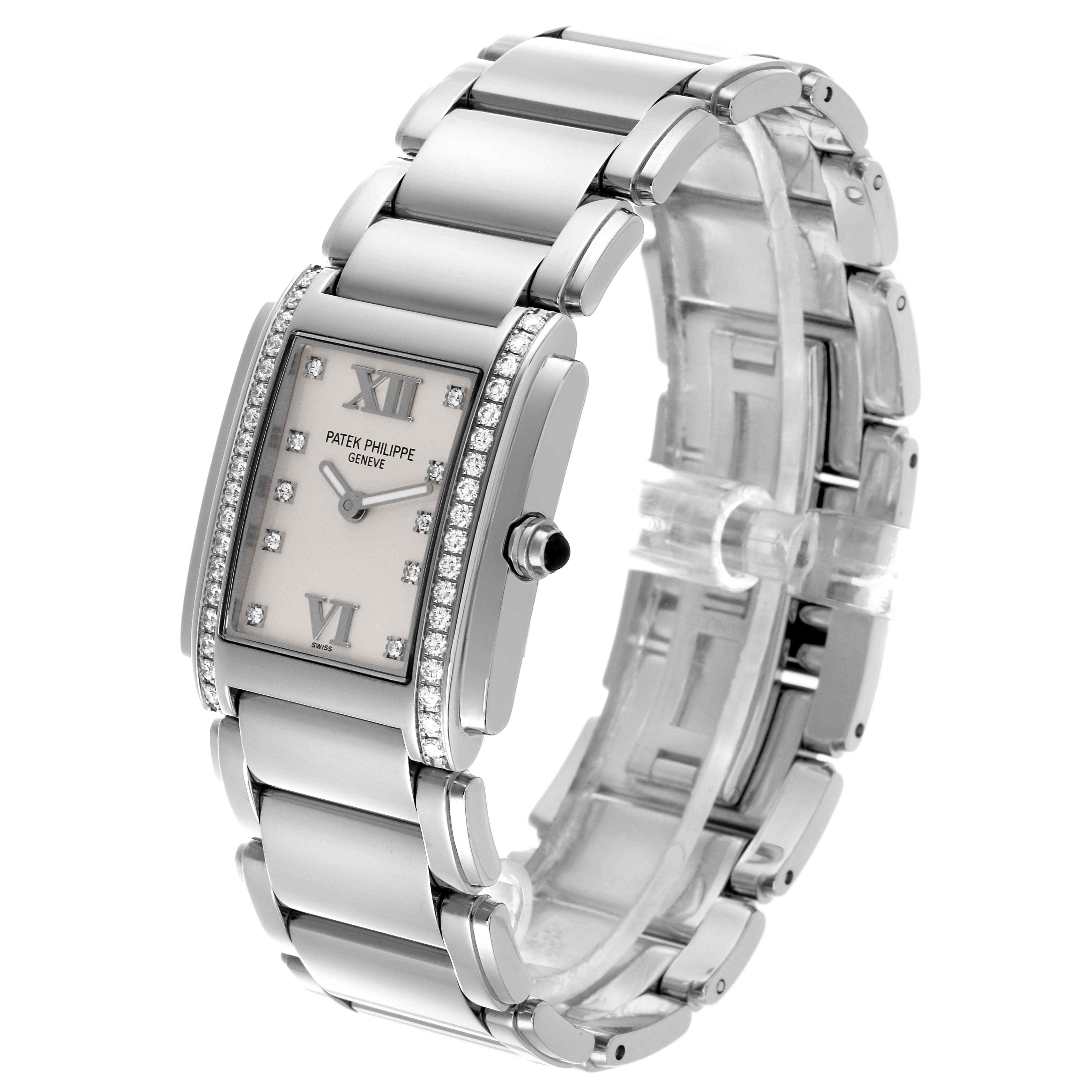 The image shows a Patek Philippe Twenty-4 4910/10A-011 Women's Stainless Steel Silver Dial 4910/10A-011 Women's Stainless Steel Silver Dial watch at a side angle, highlighting its rectangular face, bracelet, and diamond accents.