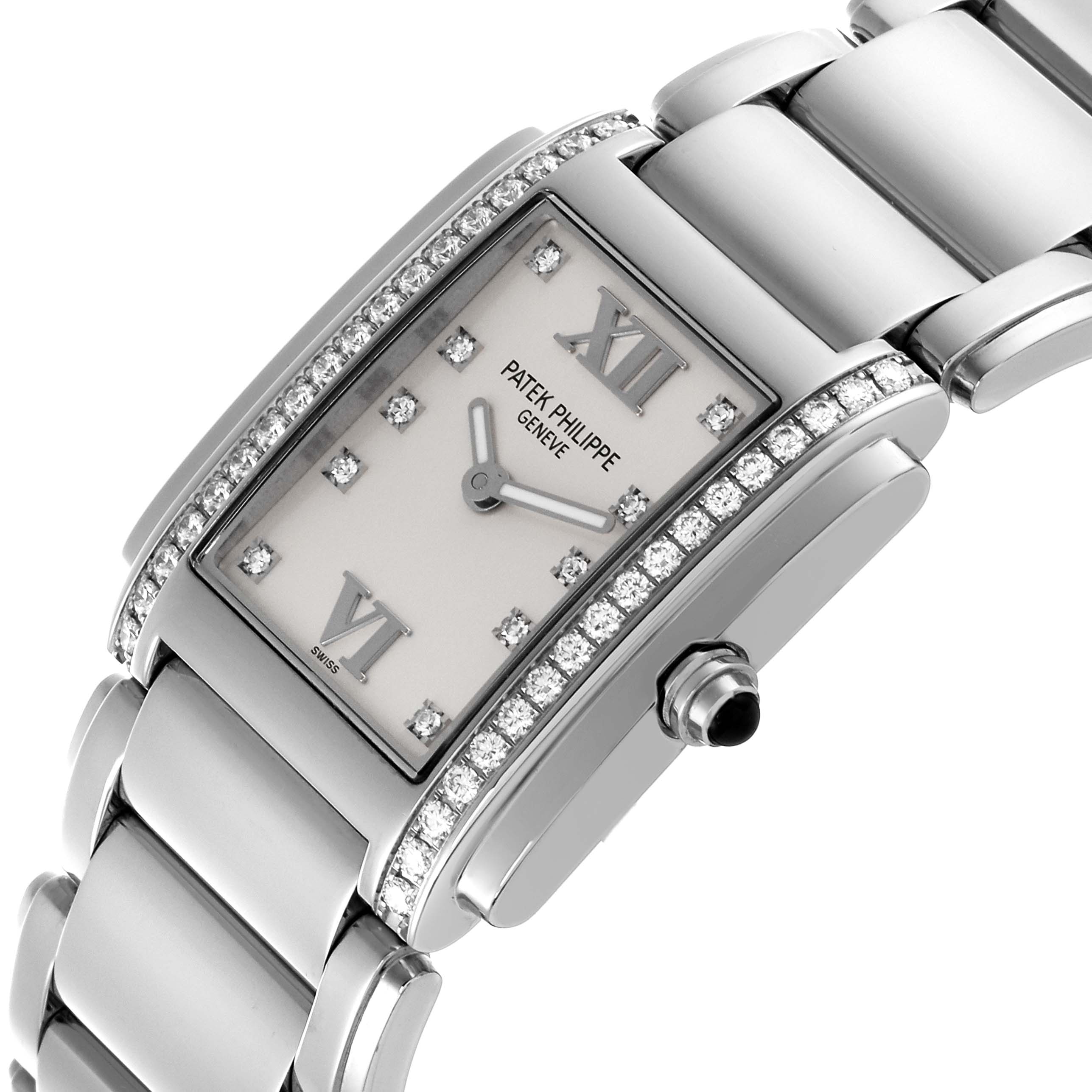 The Patek Philippe Twenty-4 4910/10A-011 Women's Stainless Steel Silver Dial 4910/10A-011 Women's Stainless Steel Silver Dial watch is shown from an angled side view, highlighting the diamond-set bezel, silver dial, and bracelet.
