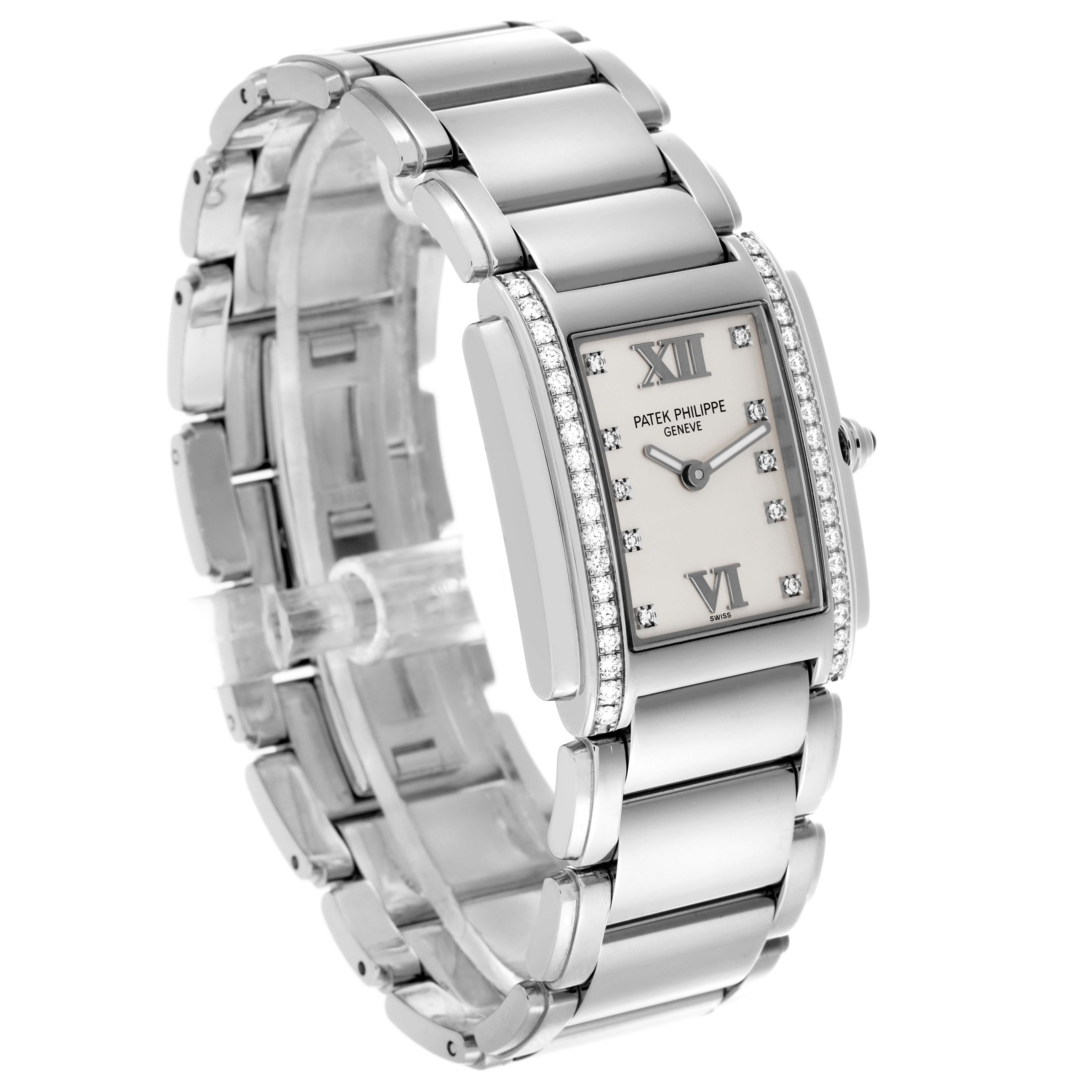 The Patek Philippe Twenty-4 4910/10A-011 Women's Stainless Steel Silver Dial 4910/10A-011 Women's Stainless Steel Silver Dial watch is shown at an angled view, highlighting the rectangular face, diamonds, and metal bracelet.