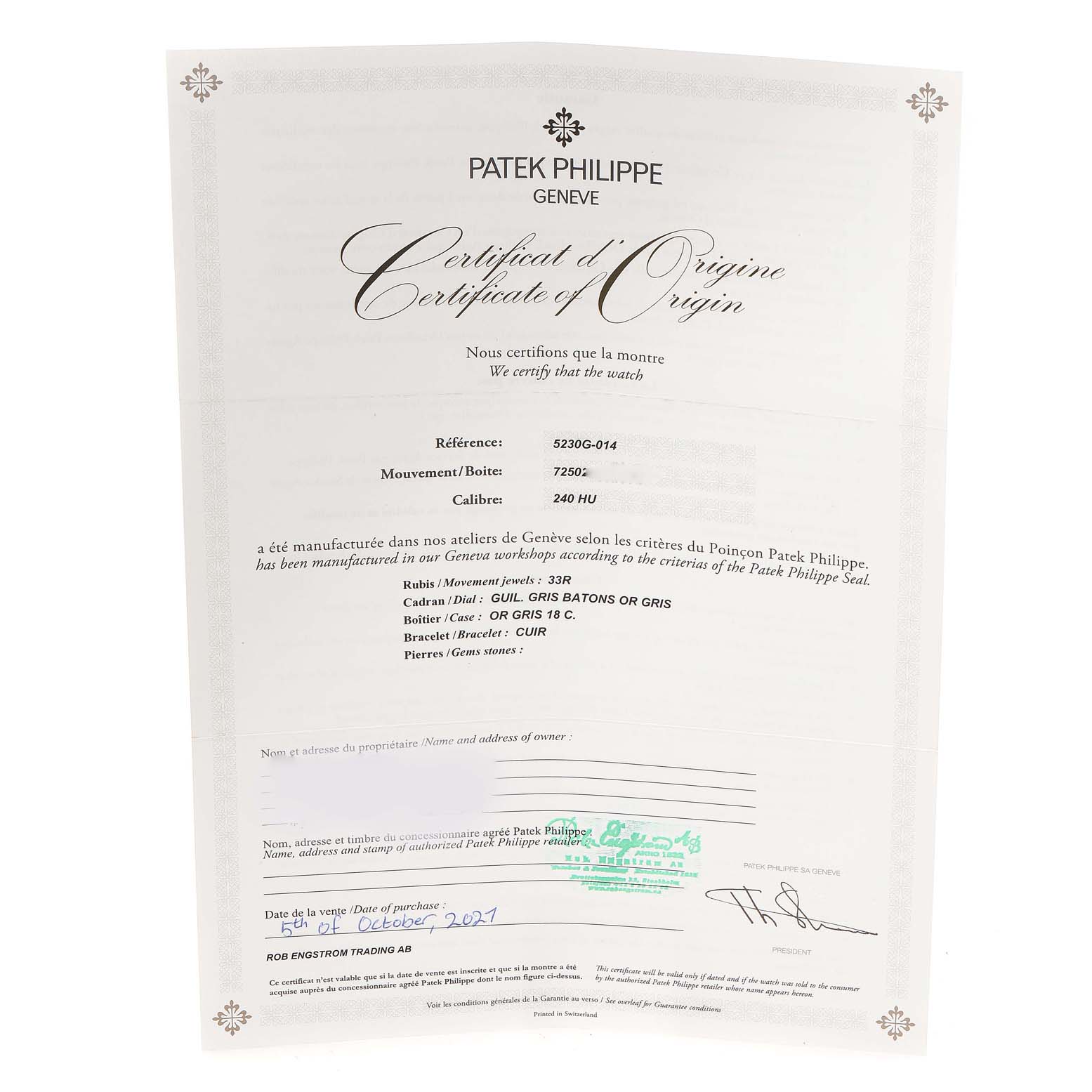 This is the Certificate of Origin for a Patek Philippe Complications 5230G Men's White Gold Grey Dial 5230G Men's White Gold Grey Dial model 5230G-014, shown from a top-down angle.