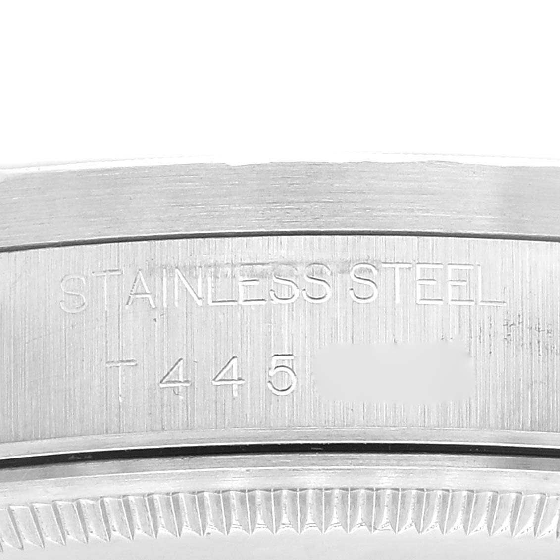 This image shows a close-up of the stainless steel case back edge and engravings on the Rolex Air-King 14010 Men's Stainless Steel Silver Dial 14010 Men's Stainless Steel Silver Dial watch.