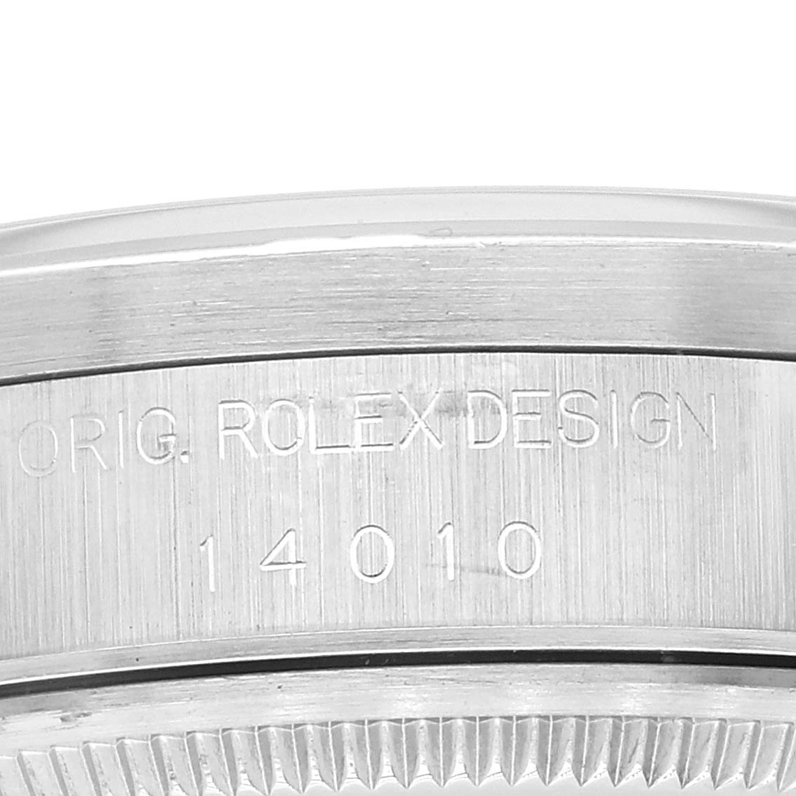 This close-up image shows the side and bezel of a Rolex Air-King 14010 Men's Stainless Steel Silver Dial 14010 Men's Stainless Steel Silver Dial watch, featuring engravings and fine detailing.