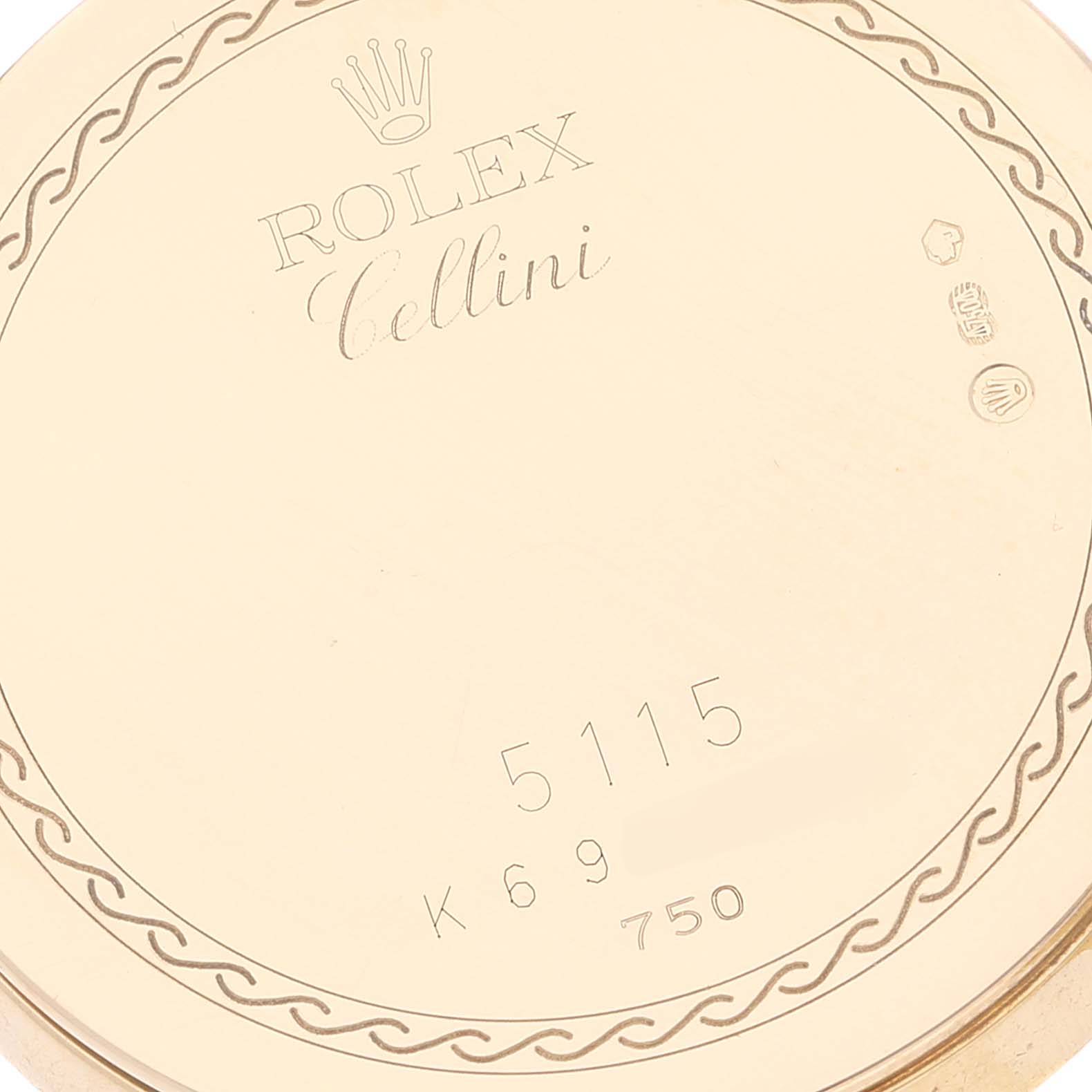 The image shows the back cover of a Rolex Cellini 5115/8 Men's Yellow Gold Beige Dial 5115/8 Men's Yellow Gold Beige Dial watch, highlighting the model number 5115 and gold hallmarks.
