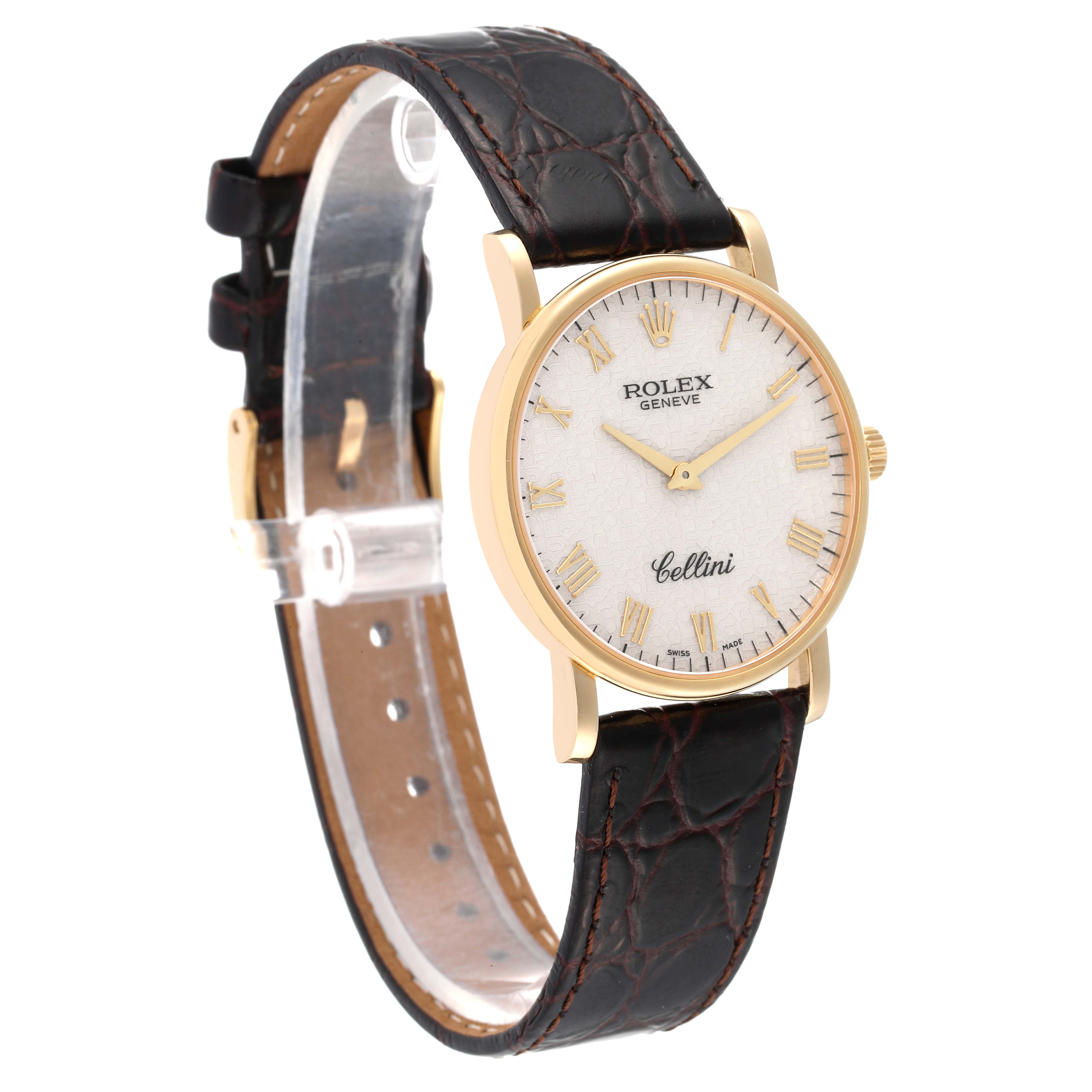 The Cellini model by Rolex is shown at a slight angle, highlighting the watch face, gold case, and leather strap.