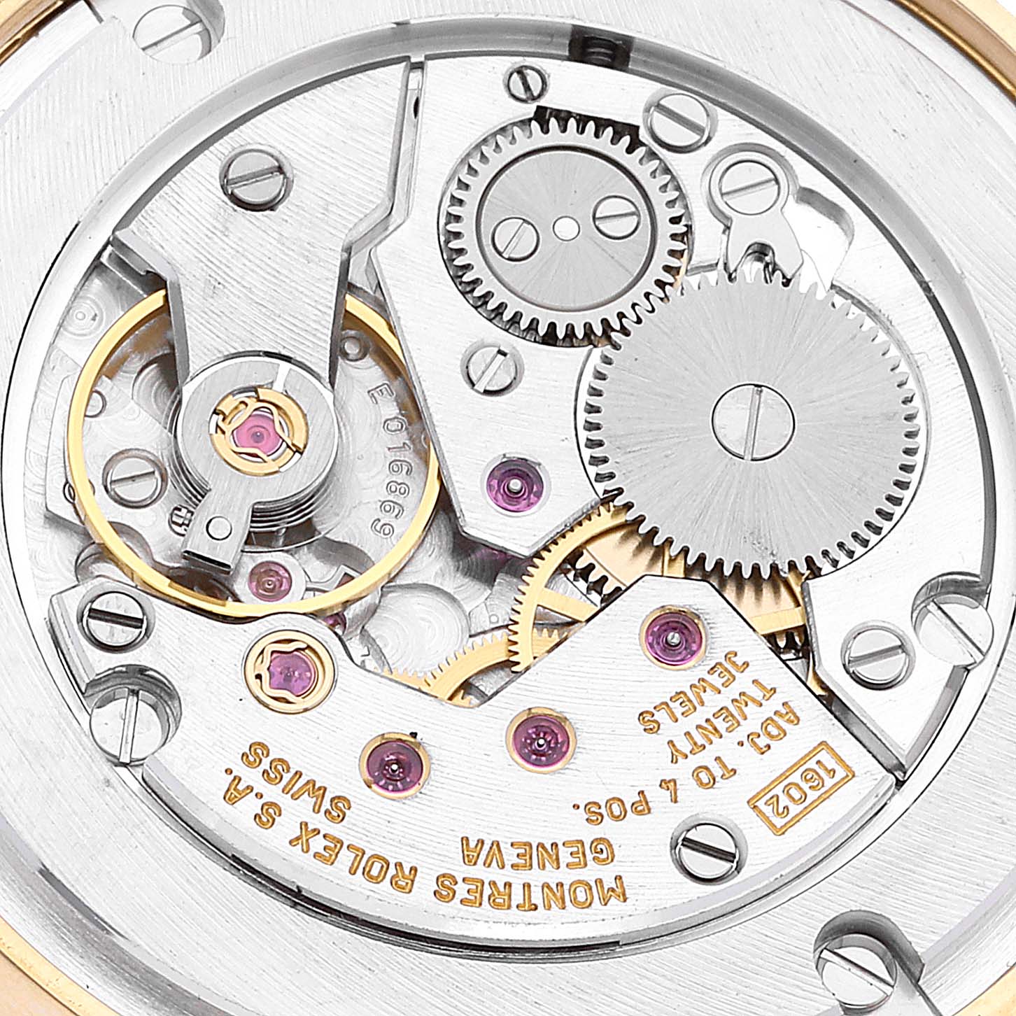 The image shows the intricate inner mechanisms of a Rolex Cellini 5115/8 Men's Yellow Gold Beige Dial 5115/8 Men's Yellow Gold Beige Dial watch, highlighting gears and inscriptions.