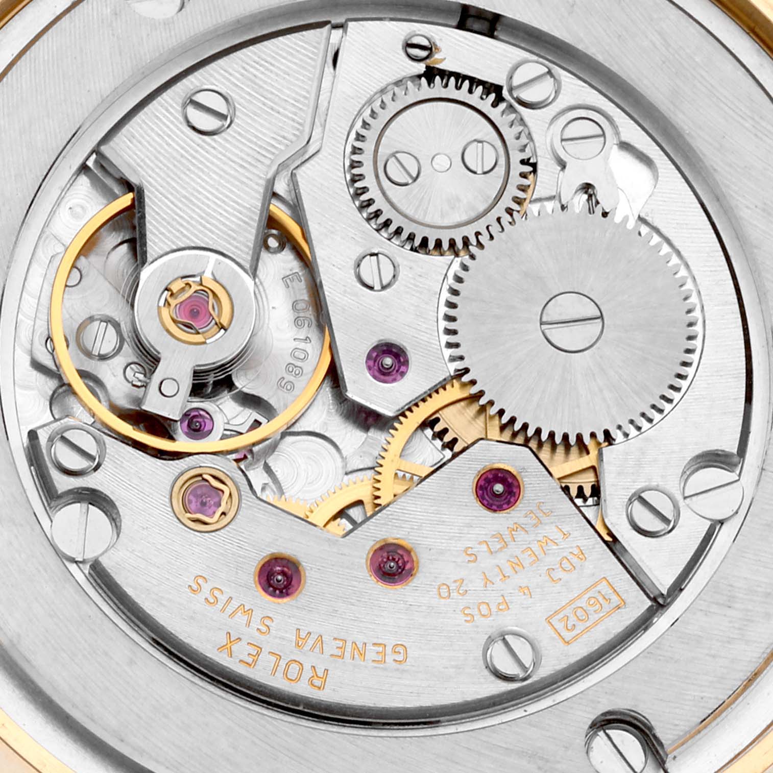 This close-up shot of the Rolex Cellini 5115/8 Men's Yellow Gold White Dial 5115/8 Men's Yellow Gold White Dial showcases its intricate movement and internal mechanisms.