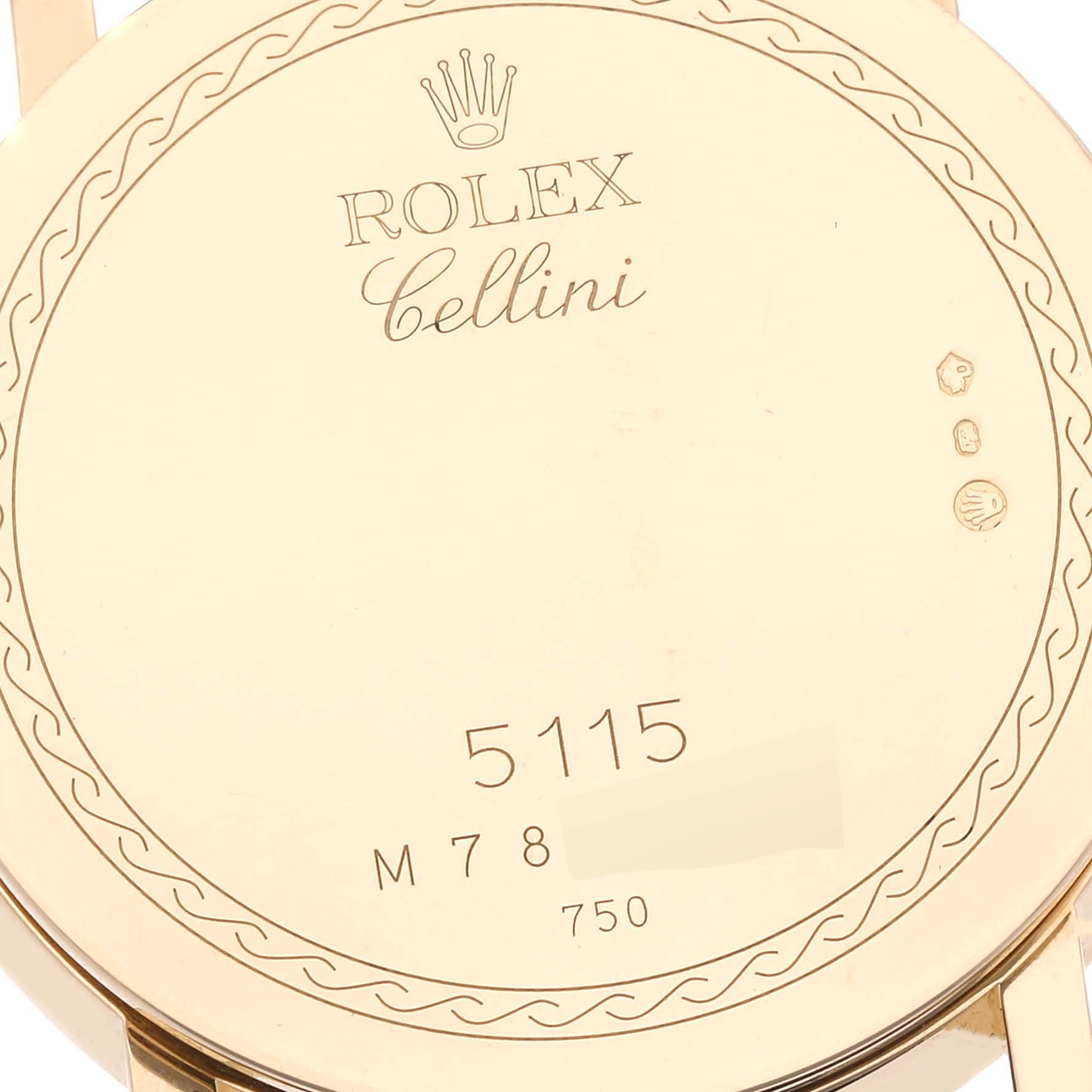 The image shows the back case of a Rolex Cellini 5115/8 Men's Yellow Gold White Dial 5115/8 Men's Yellow Gold White Dial model watch, including its brand engraving and model number.