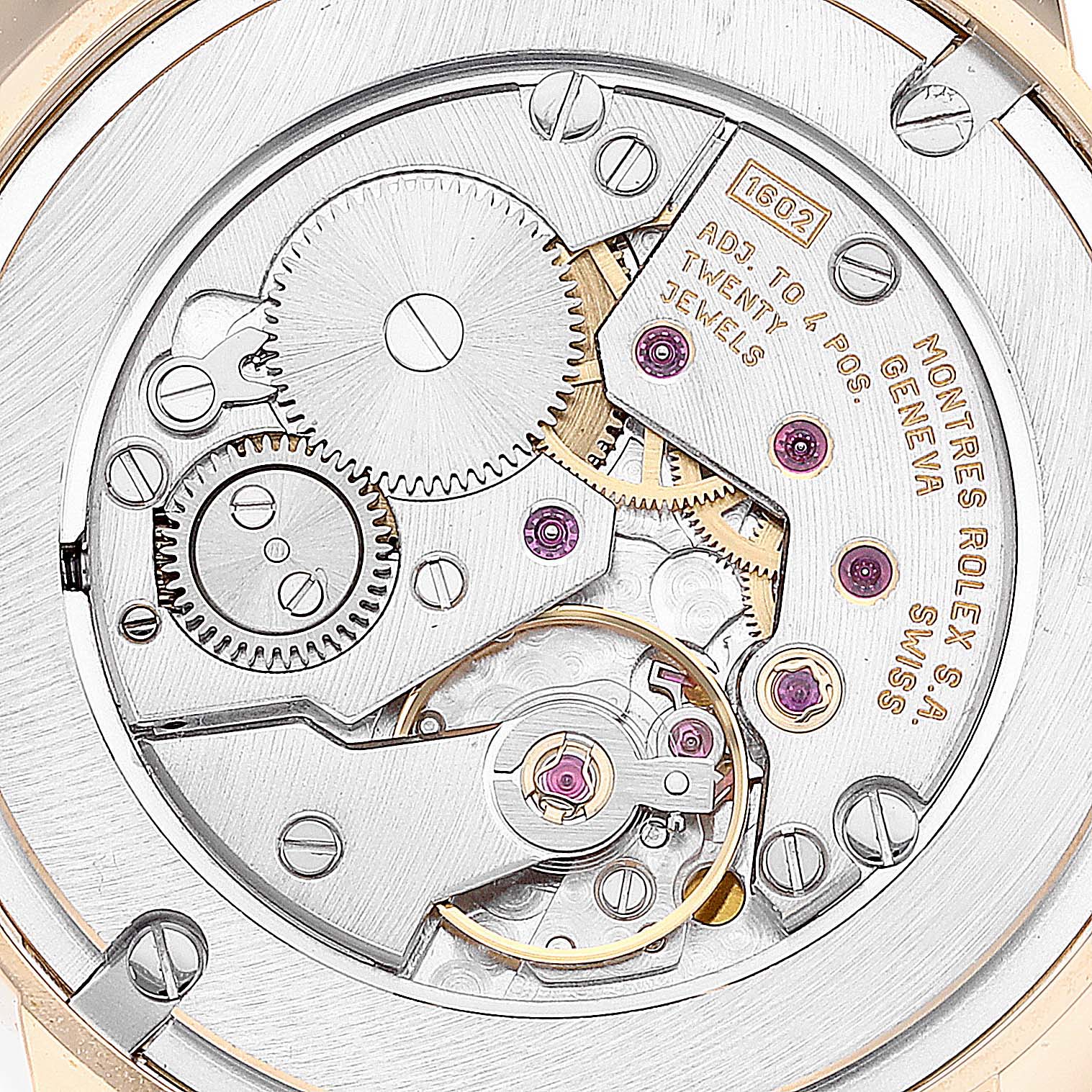 The image shows the intricate inner mechanisms and gears of a Rolex Cellini 5116 Men's Yellow Gold Mother of Pearl Dial 5116 Men's Yellow Gold Mother of Pearl Dial model's movement from a close-up angle.